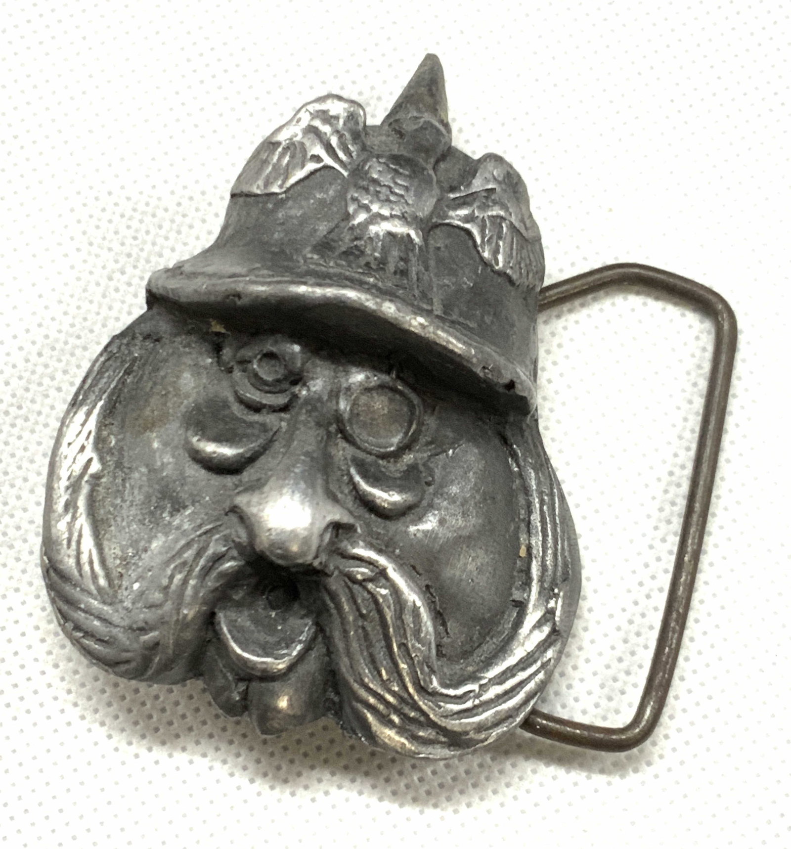 Kaiser By Black Officer Pewter Head Belt Buckle: Marked on undefined Kaiser by black, Indiana Metal craft Corp, Bloomington. Peter made belt buckle with a mustachioed face of a man wearing a German officers Pickelhaube helmet with an eagle motif on 