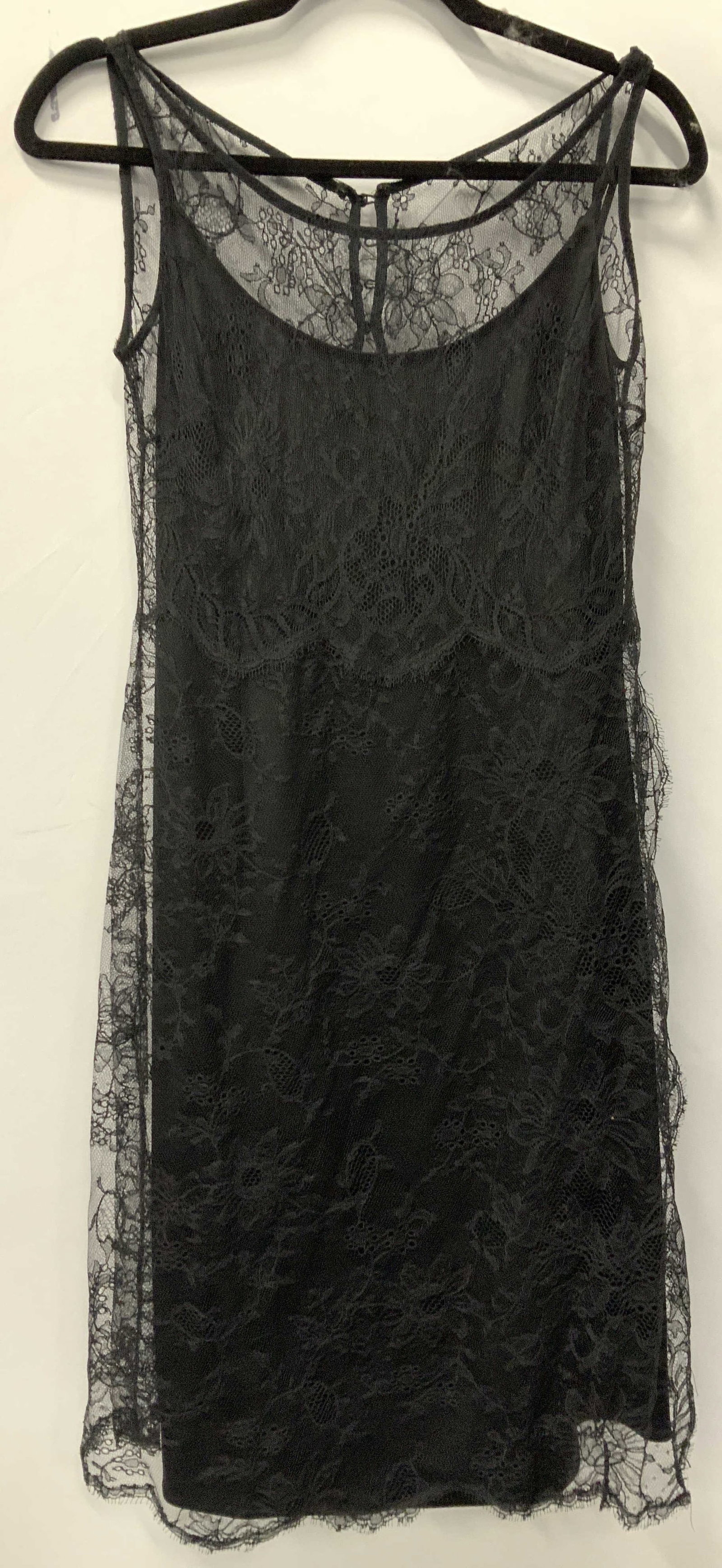 Vntg Badgley Mischka Sleeveless Lace Dress, USA: Labeled BADGLEY MISCHKA SIZE 4 dress. Floral lave over 100% silk lining. Sleeveless Dress, Made in USA. Backside lace is all button up. Lining has a zipper. Side slit on lace which drapes over the dre