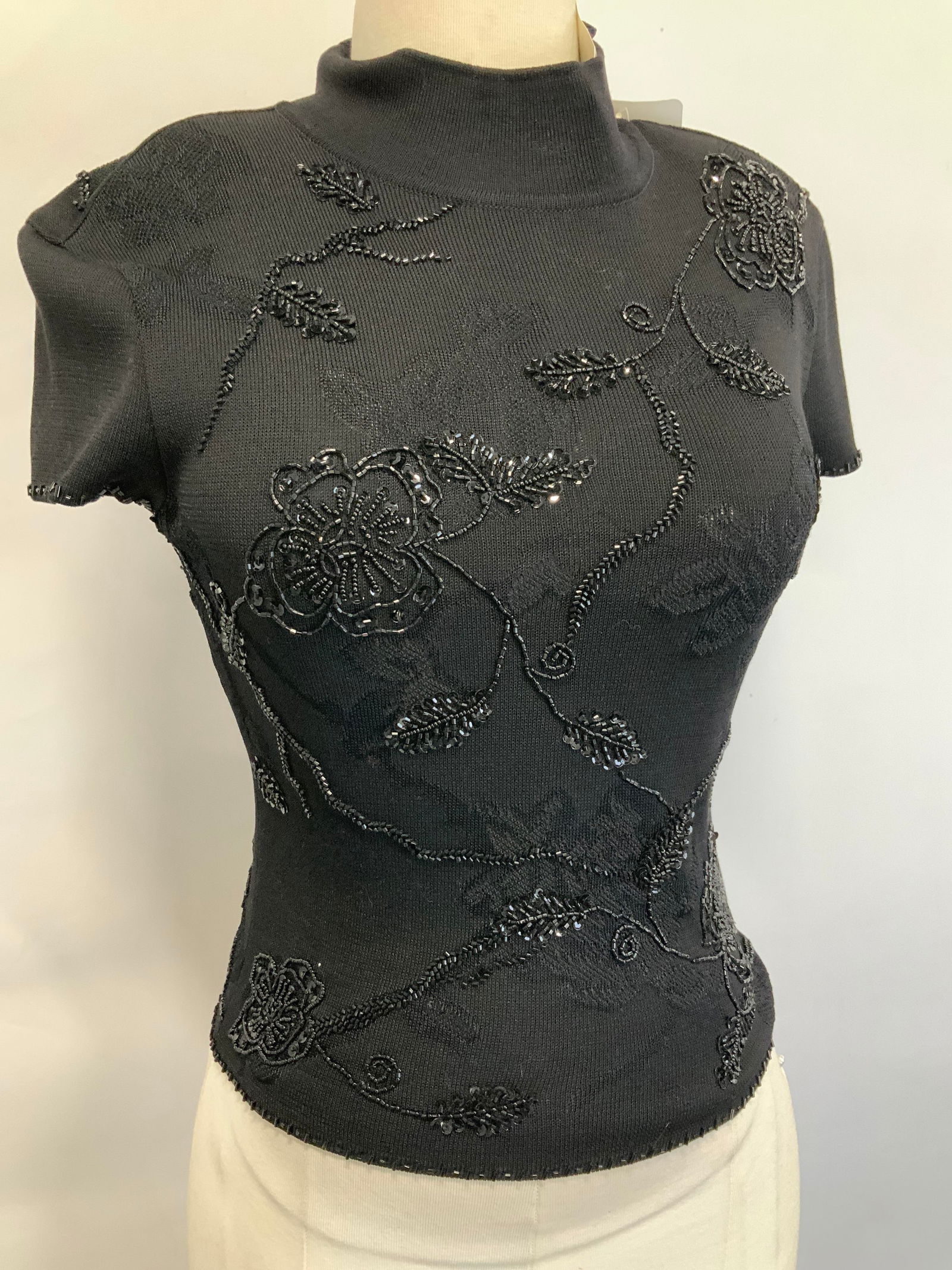 ESCADA Hand Beaded Cocktail Sweater, NWT: Labeled Escada luxury cap sleeve sweater , hand beaded with black aurora borealis black seed beads. Leaf and flower design.Made in Germany. NEW WITH TAGS ATTACHED. mock turtleneck, 3 back of neck butt