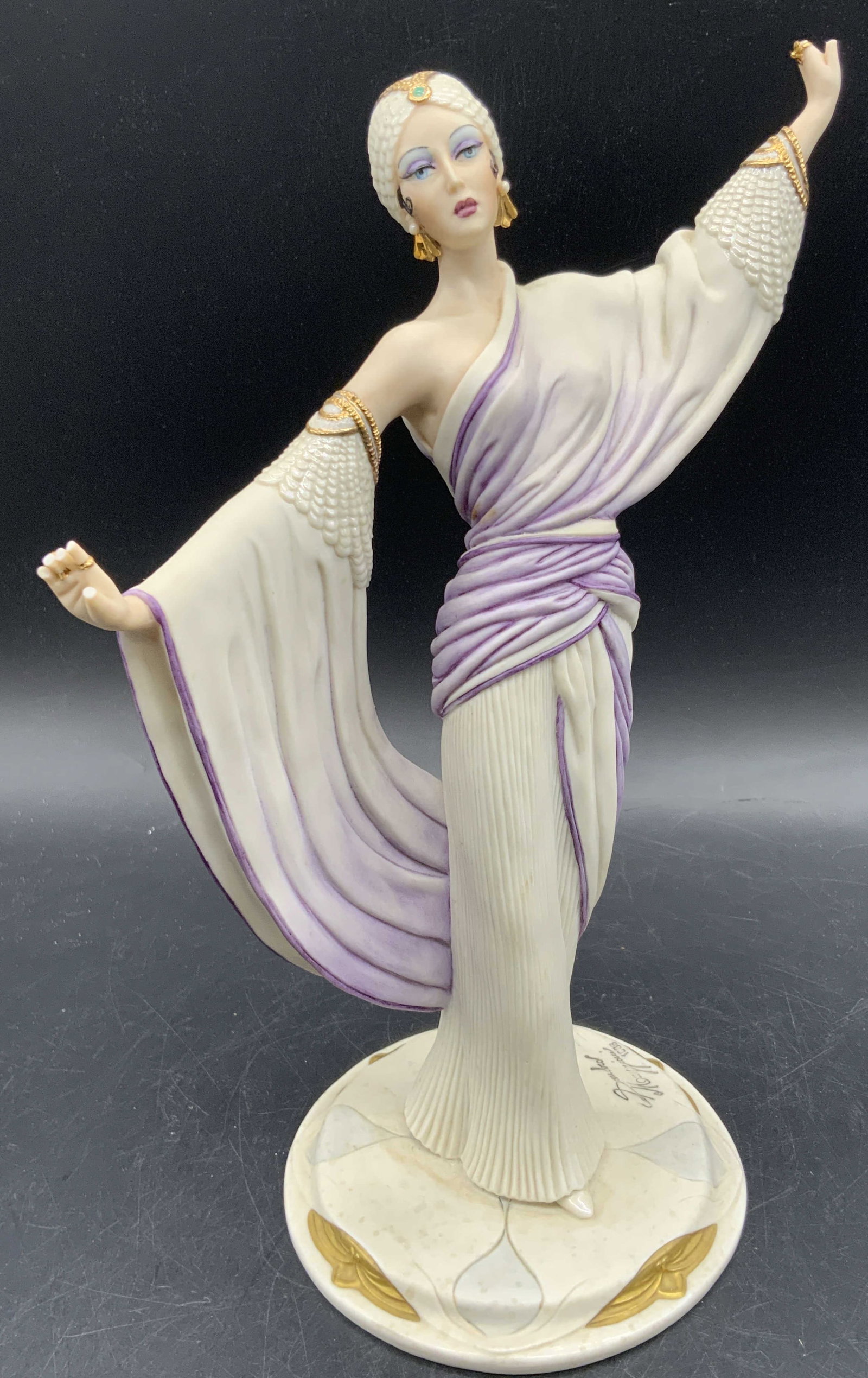 SANDRO MAGGIONI CAPODIMONTE Porcelain Figural: A vintage porcelain figural depicting a woman standing with her arms outstretched. The base of the figural is signed SANDRO MAGGIONI 1986. The underside is stamped CAPODIMONTE MADE IN ITALY, MODE LIBE