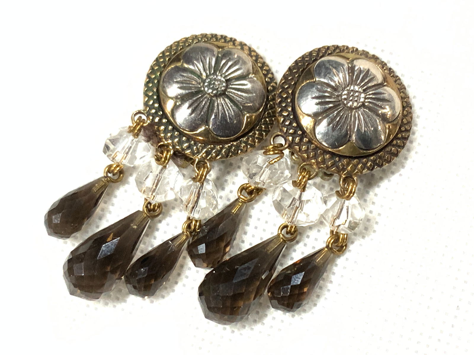 Stephen DWECK Sgd Sterling & Quartz Clip Earrings: Stamped on backside Stephen DWECK, dangle clip on earrings with gold tnd metal earrings with sterling floral motifs in the centers. Tested positive using puritest metal tester. earrings have faceted w