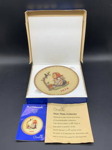 GOEBEL MJ HUMMEL Hand Painted Plate W/ Box: A hand painted porcelain GOEBEL MJ HUMMEL Plate contained in its original box and packaging. The obverse features a raised relief of a child & bird, 1978, and impressed MJ HUMMEL. Reverse stamped for