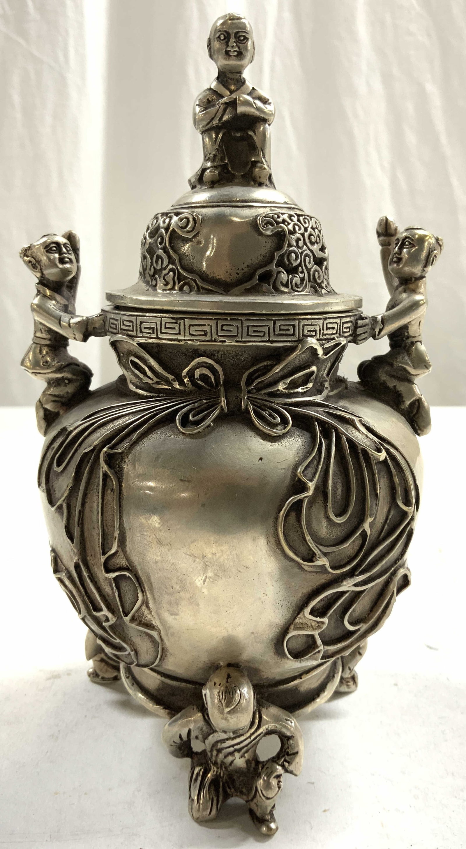 Signed Silvered Brass Lidded Asian Incense Burner: Incense burner is signed with Asian characters on underside. Piece has 2 figural handles, 3 figural feet & figural top to lid. Piece appears to be silvered brass 7.5 inches tall 4.25 inches wide. Ince