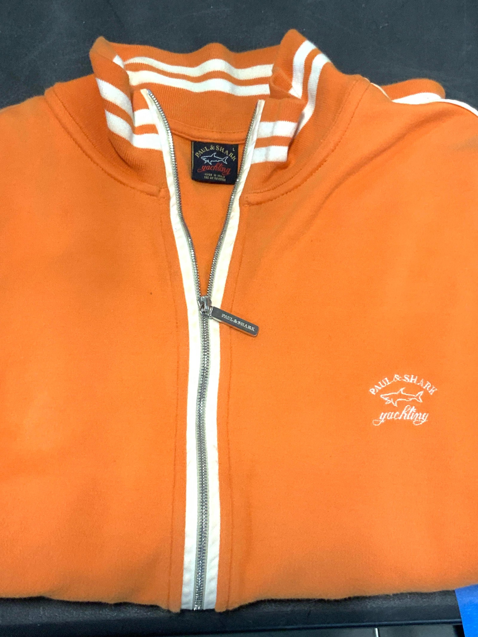 Paul & Shark Yachting Italy Sportswear Jacket: Orange cotton jacket with white striping , hand pockets and arm pocket. Designer label affixed reads Paul & Shark yachting Made in Italy. Has some wear to fabric consistent with wear and washing. 40 i
