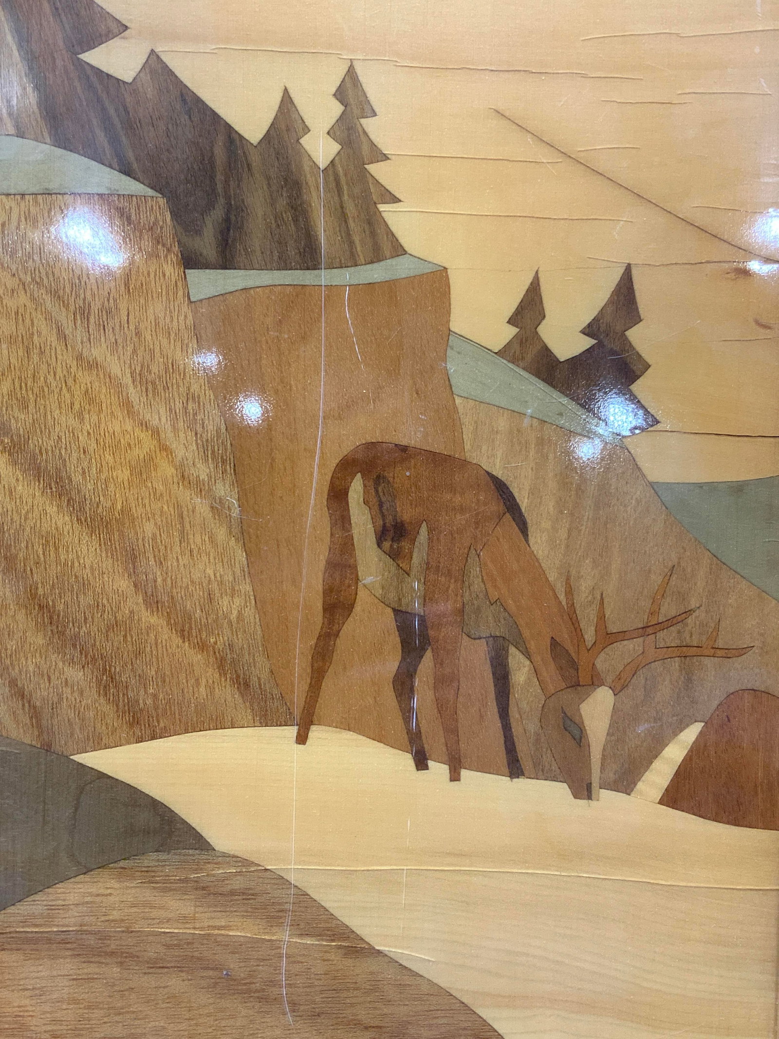 Vintage Wooden Marquetry Deer Panel: Vintage wooden marquetry panel depicting a buck grazing on a mountain side. Made with multiple wooden panels with acrylic costing over obverse side. No frame. Approximately 16.75 x 20.75 inches Eviden