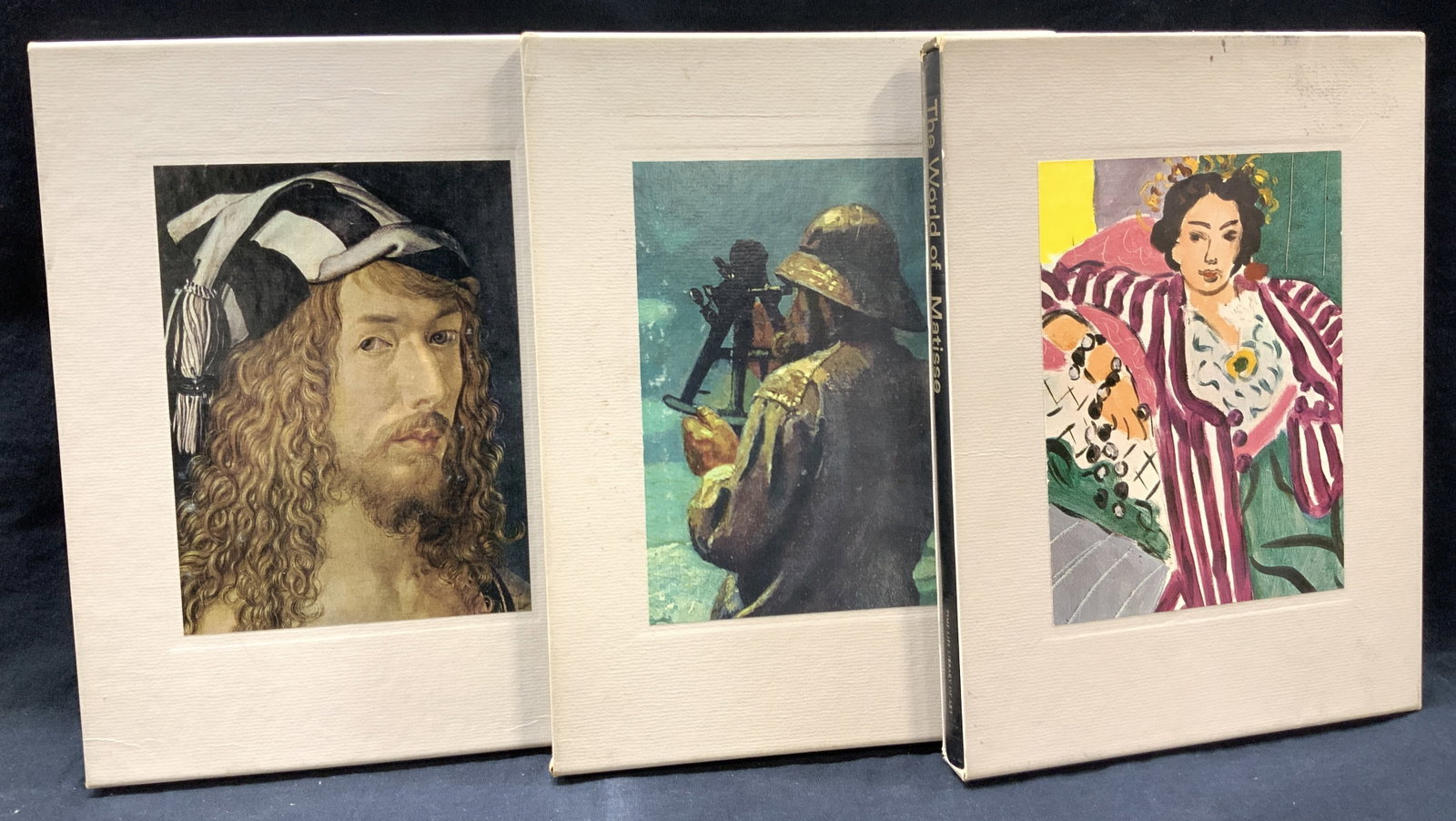 The World Of Matisse, Durer & Homer Art Books: Lot of 3 hard cover art books all with off white sleeves with artist litho on sides. The World Of Art book series. Matisse copyright 1969 publisher Joan. D. Manley. The world of Durer, copyright 1967,