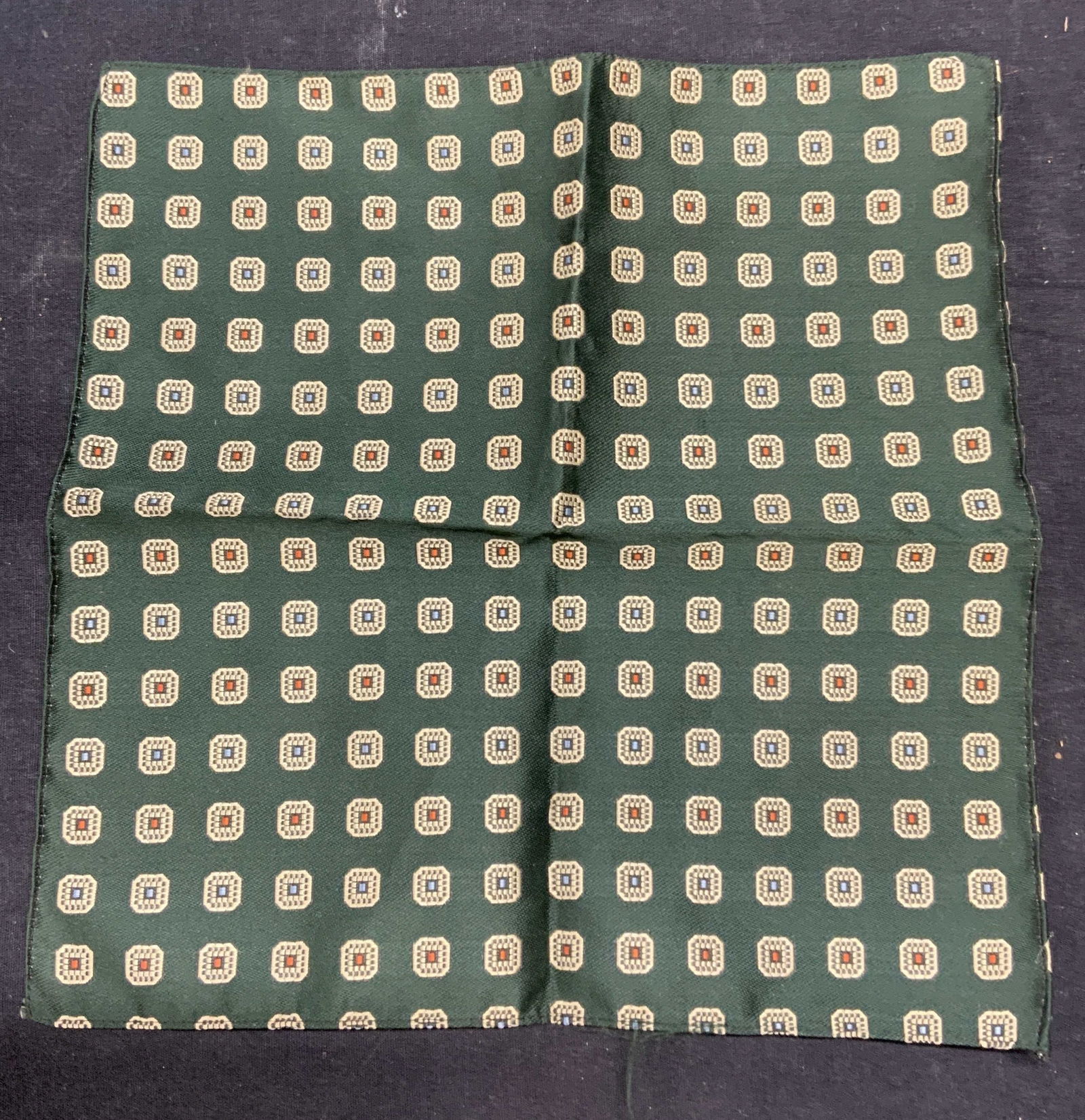 Green Embroidered Pocket Square: Green embroidered geometric pattern pocket square. Material feels synthetic. Measures approx. 10.5 x 10 inches. Some wear to material consistent with exposure. Pocket square, green pocket square, geom