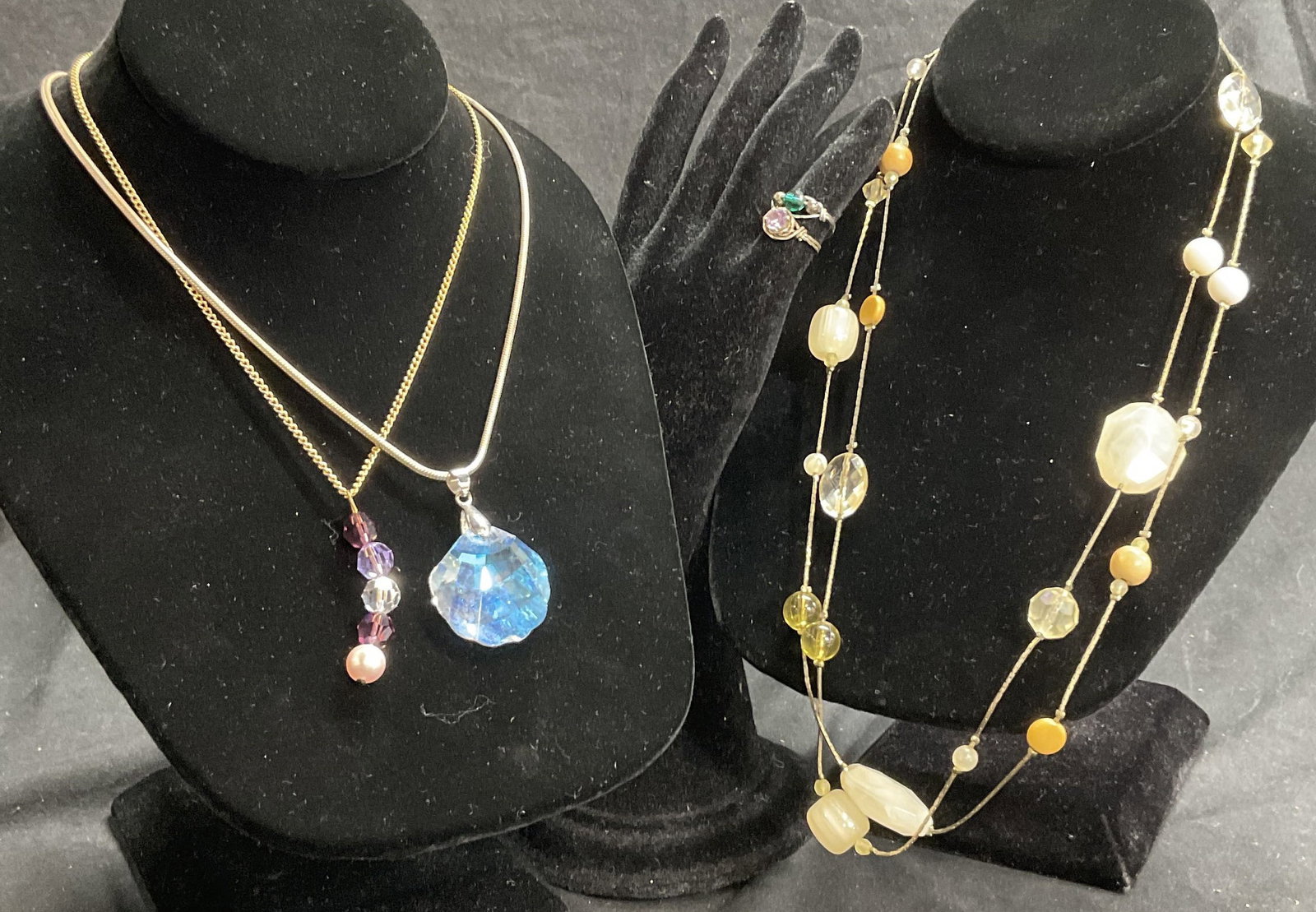 Lot 5 Jewelry Aurora Borealis necklaces & Rings: Jewelry Aurora Borealis necklaces & Rings. Silver toned necklace with shell shaped Aurora borealis crystal. Clasp stamped 18K GP. Drop measures 8 in. Gold toned necklace stamped Sarah Cov with purple 