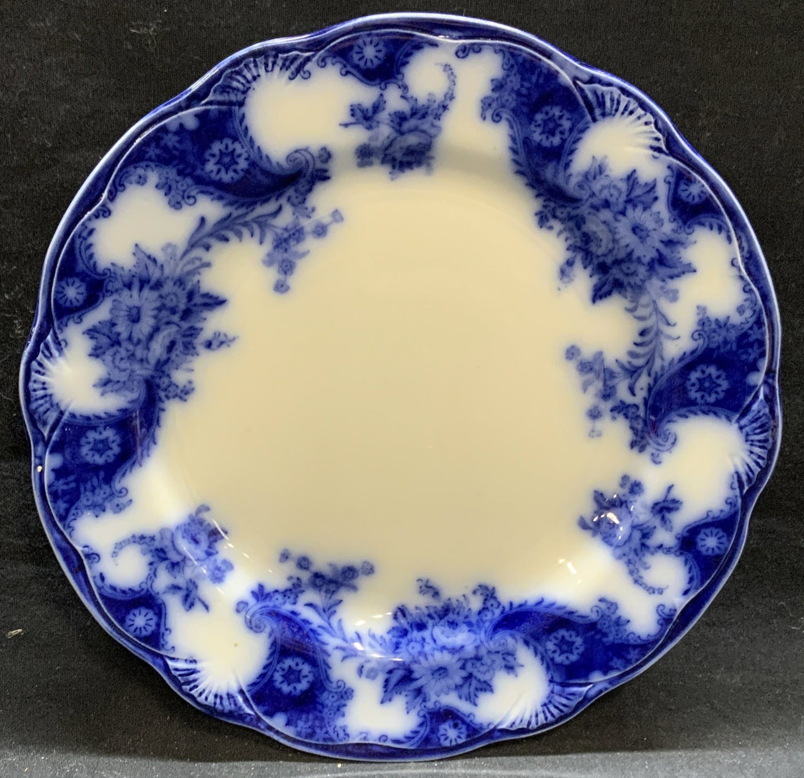Antq NewWharf Pottery Lois Porcelain Plate England: Antique circa 1890-94 New Wharf Pottery porcelain plate in Lois pattern. Measures approx. 9.75 inches diameter. Surface wear including scratching and small chip observed. Trademarked to underside. Mad