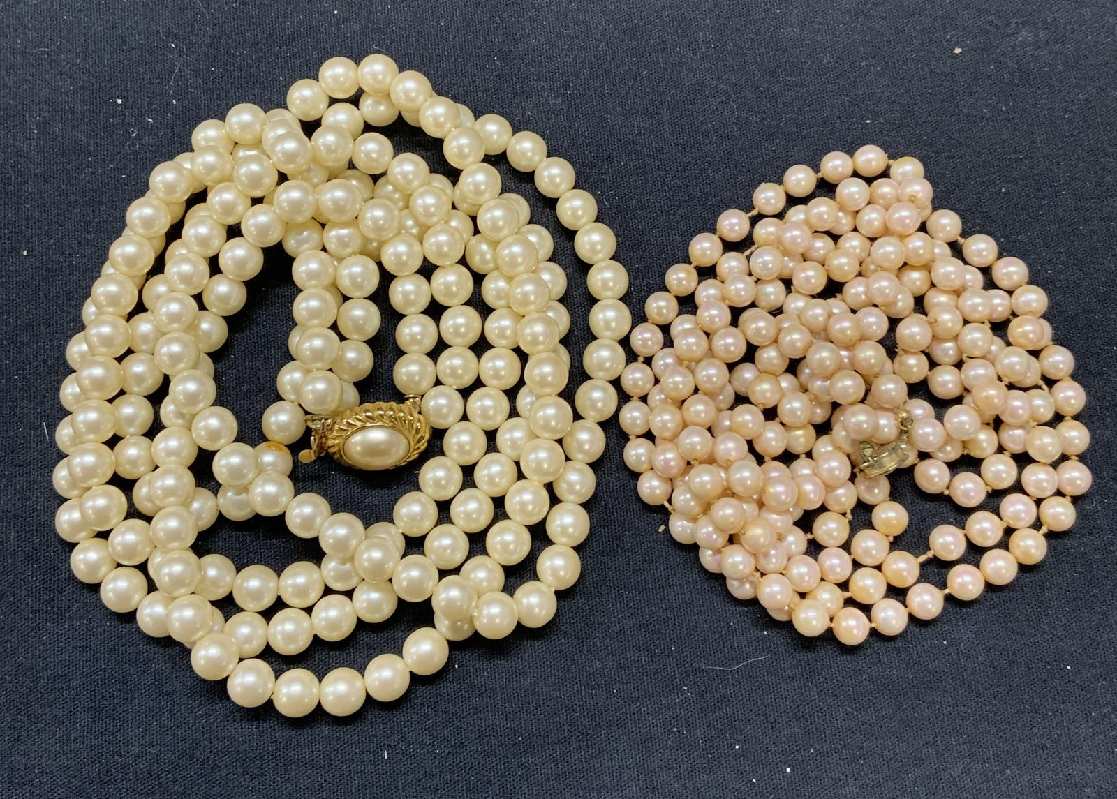 Lot 2 Faux Pearl Necklaces, Jewelry: Lot of 2 faux pearl necklaces. Pink toned faux pearl necklace. Drop length approx. 28.25 inches. White toned double strand faux pearl necklace. Drop length approx. 13.25 inches. Both pieces have some 