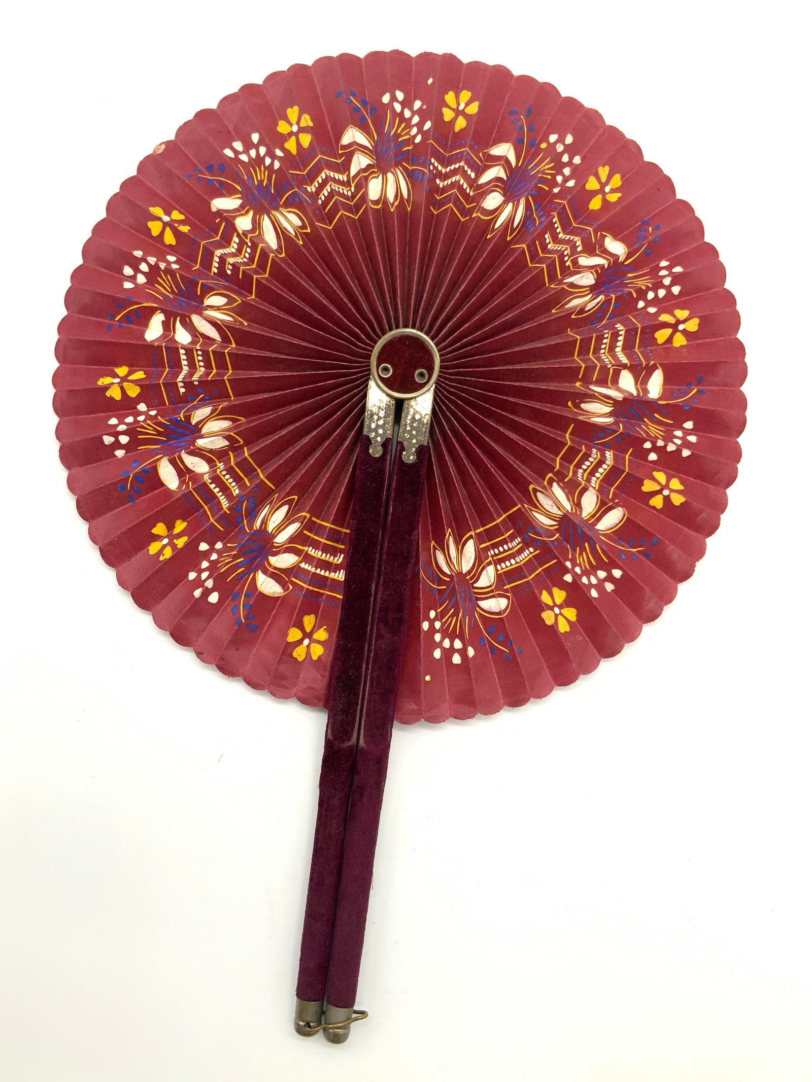 Antique Hand Painted Maroon Cockade Hand Fan: Antique cockade fan with maroon toned felt on exterior handles. Fan folds out to hand painted flowers on the fabric. Approximately 9 inches long, unfolded, folded outwards measures 14 inches long. Evi