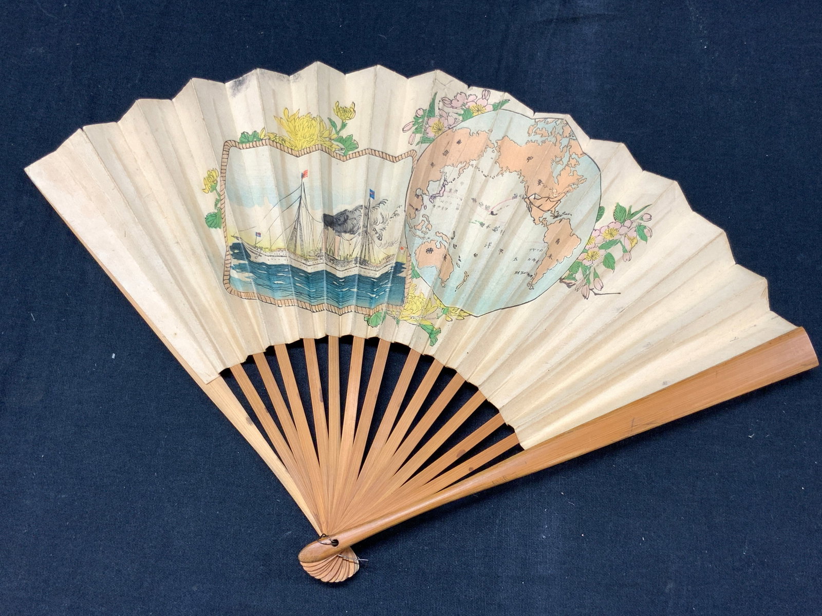 Antique Hand Painted & Written Paper Japanese Fan: Antique hand painted Japanese hand flag, made with paper and possibly bamboo frame. One side of fan has painted motifs of a Japanese military ship with a map image of japan and the other side has (pos
