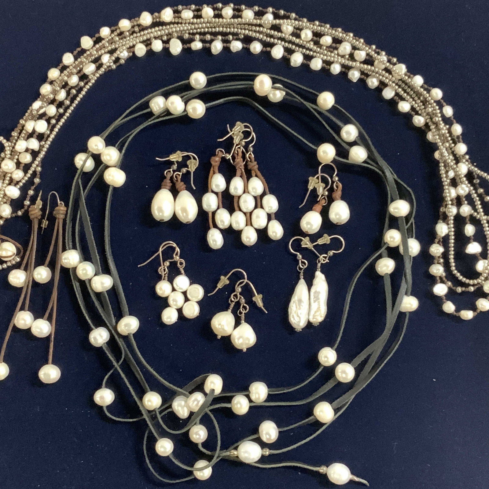 Cultured Pearl Earring Sets, Necklaces, 17: 569 carats total weight of cultured pearls. 17 individual pieces of handmade jewelry , all with baroque Pearls or cultured pearls. Made with leather cords. 6 pairs of dangle earrings with sterling sil