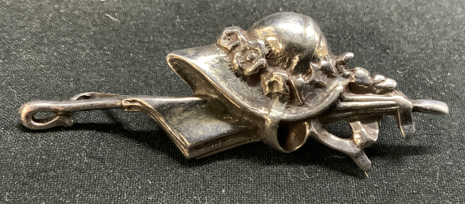 Sterling Silver Straw Hat & Umbrella Brooch Pin: Brooch pin is inscribed 925. Piece is sterling silver. Brooch depicts straw hat & umbrella. Piece measures approx 2 inches long .75 inches tall. Weight approx .17 ozt. Brooch, brooch pin, sterling sil