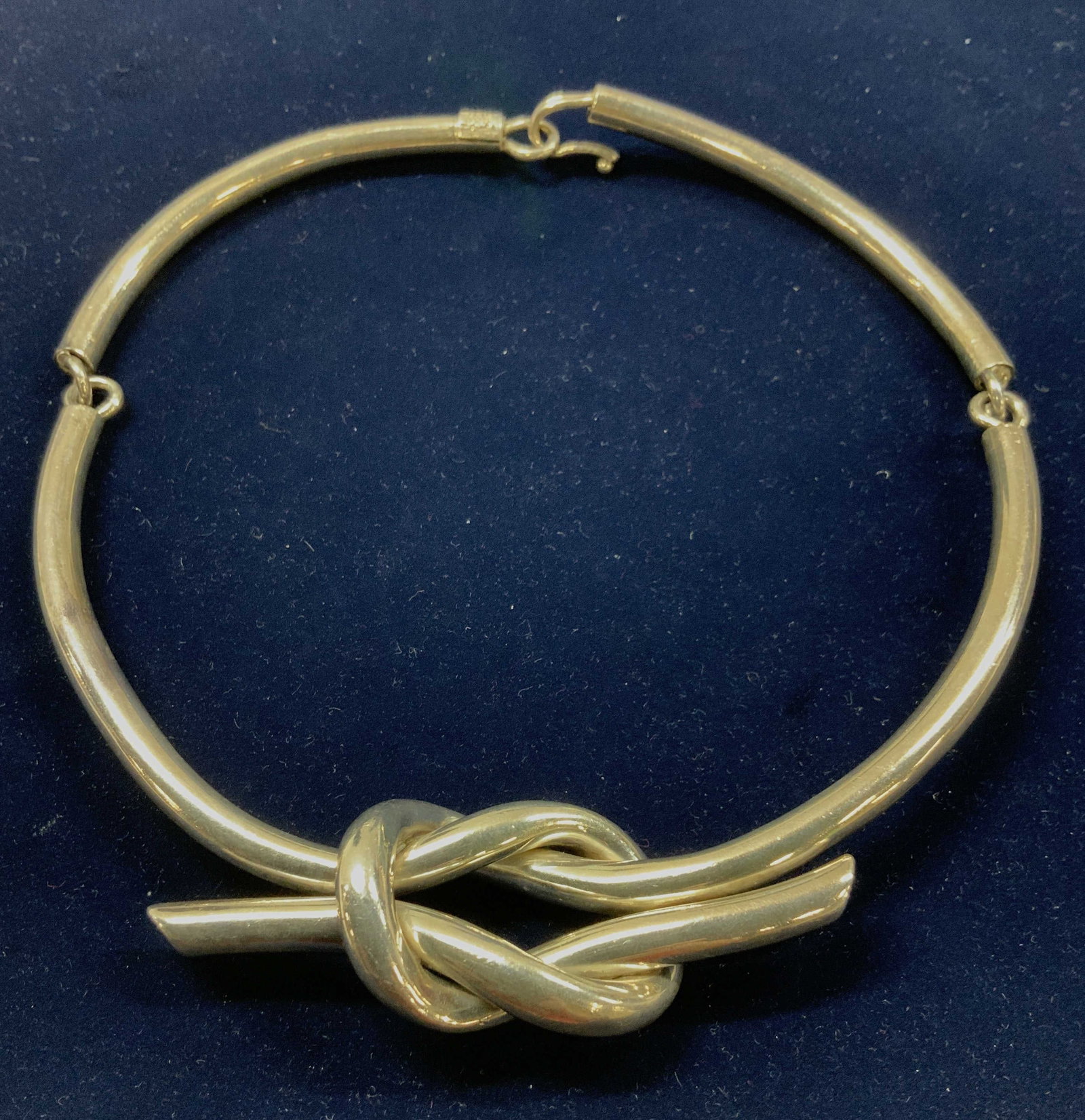 Love Knot Sterling Silver Collar Necklace, Mexico: Handmade luxury sterling silver necklace, made in TAXCO, Mexico. Hallmarked 925 Mexico TC-51. Hook and loop closure, double love knot , drop is 6 in. 5.5 in. Wide. Love knot measures 3.5 x 1.25 in. Ma