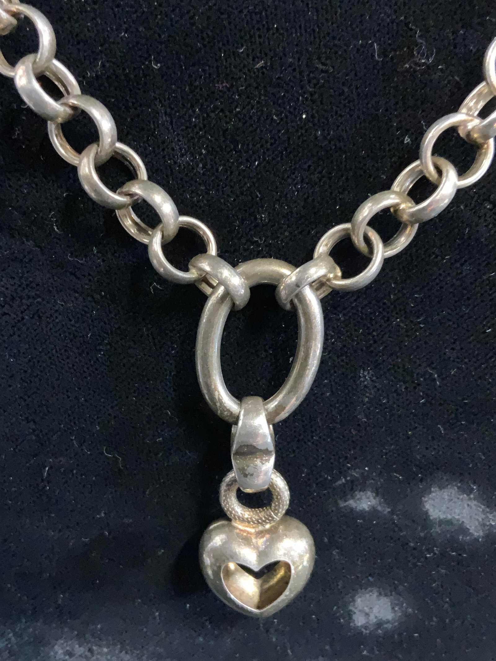 Sterling Silver Chain Link Necklace ITALY: Clasp is inscribed 925 ITALY. Necklace is chain linked. Piece has heart shaped pendant. Necklace drop measures 7 inches. .83 ozt. Necklace, jewelry, women’s jewelry, women’s necklace, sterling sil
