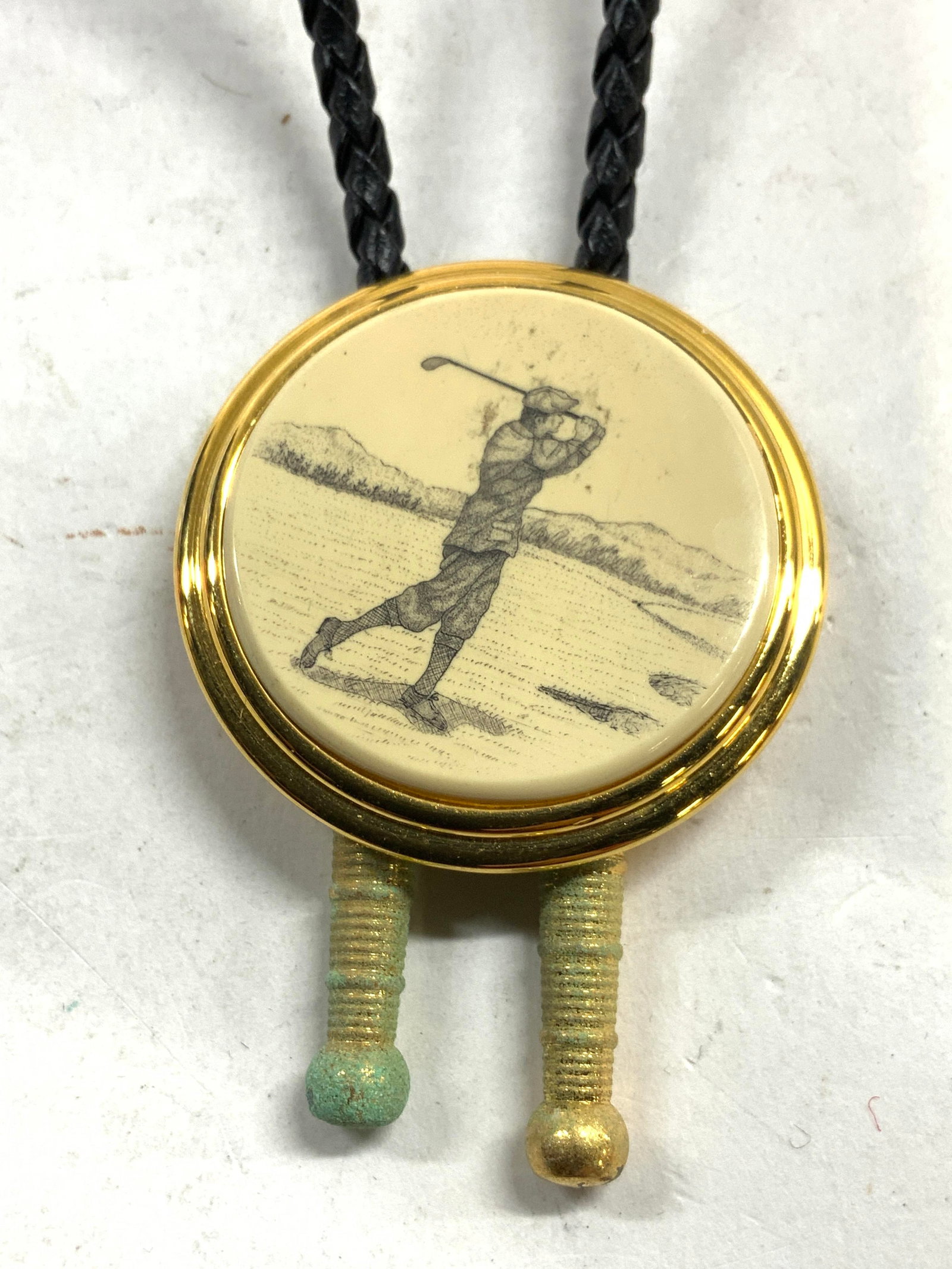 BARLOW Golf Pendant Necklace: Backside of pendant is inscribed BARLOW. Pendant has depiction of male figure playing golf. Drop length 16 inches pendant 1.5 inches diameter. Necklace, Barlow necklace, golf necklace, pendant necklac
