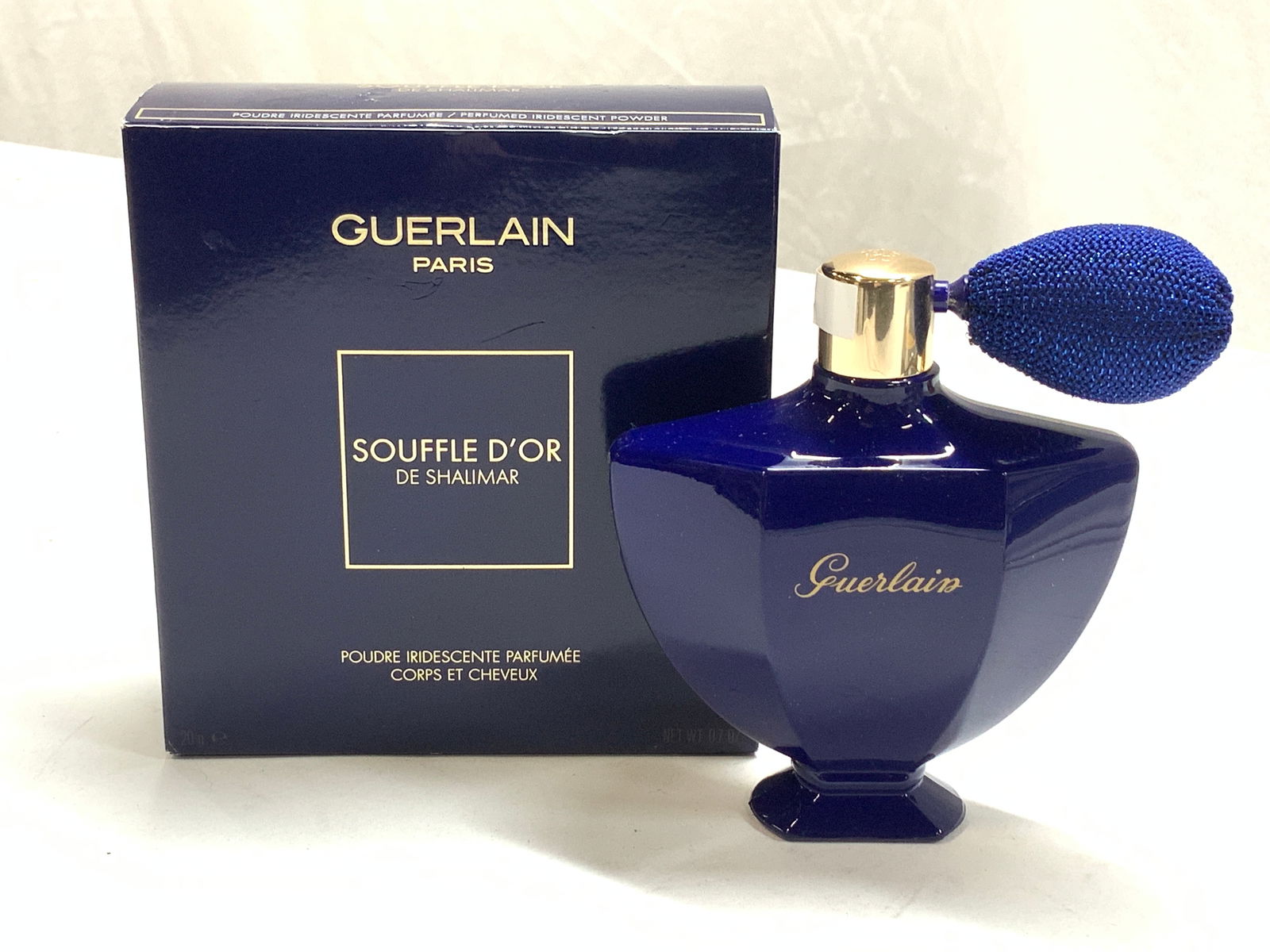 GUERLAIN Souffle DOr de Shalimar Powder NIB France: Body and hair iridescent powder in vaporizer blue bottle with metallic pump. .7 oz. New in box. Made in France. Bottle measures 4 x 4.5 in. Ht. Cosmetics, perfume scented iridescent body powder, New i