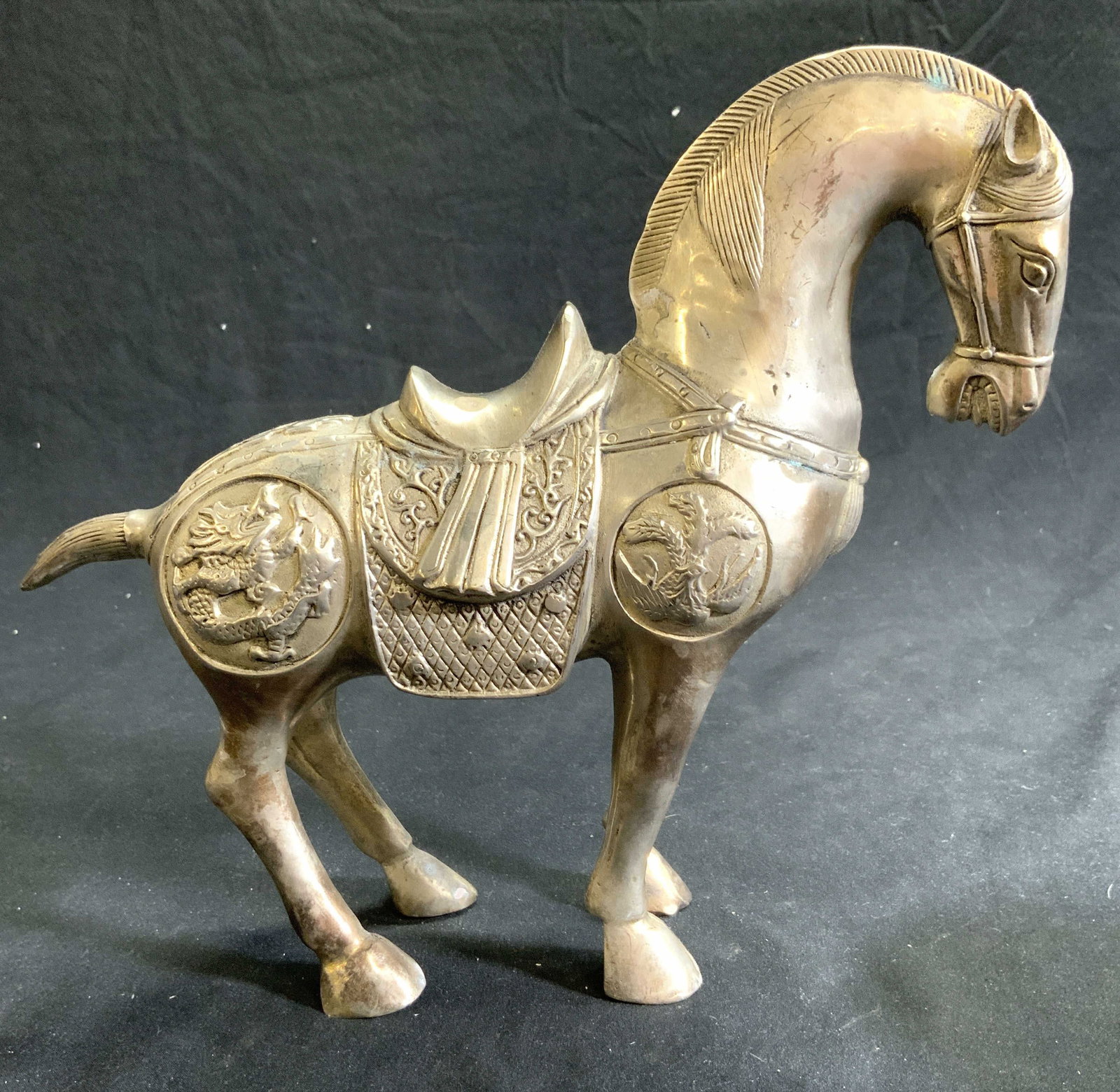 Vntg Asian Silvered Brass Horse Sculpture: Horse sculpture is silvered brass. Piece depicts horse with saddle, dragon & geometric detail. Sculpture measures approx 10 inches deep 8.25 inches tall 3.25 inches wide. Horse sculpture, horse figura