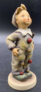 M.J Hummel Carnival GOEBEL W. Germany Figural: M.J Hummel Carnival GOEBEL West Germany figural. Side impressed M.J Hummel. Underside stamped GOEBEL W. GERMANY, 328, 47, 1957. Crafted from ceramic. Measures approx. 5.75H x 2.5W in. Some crazing, di