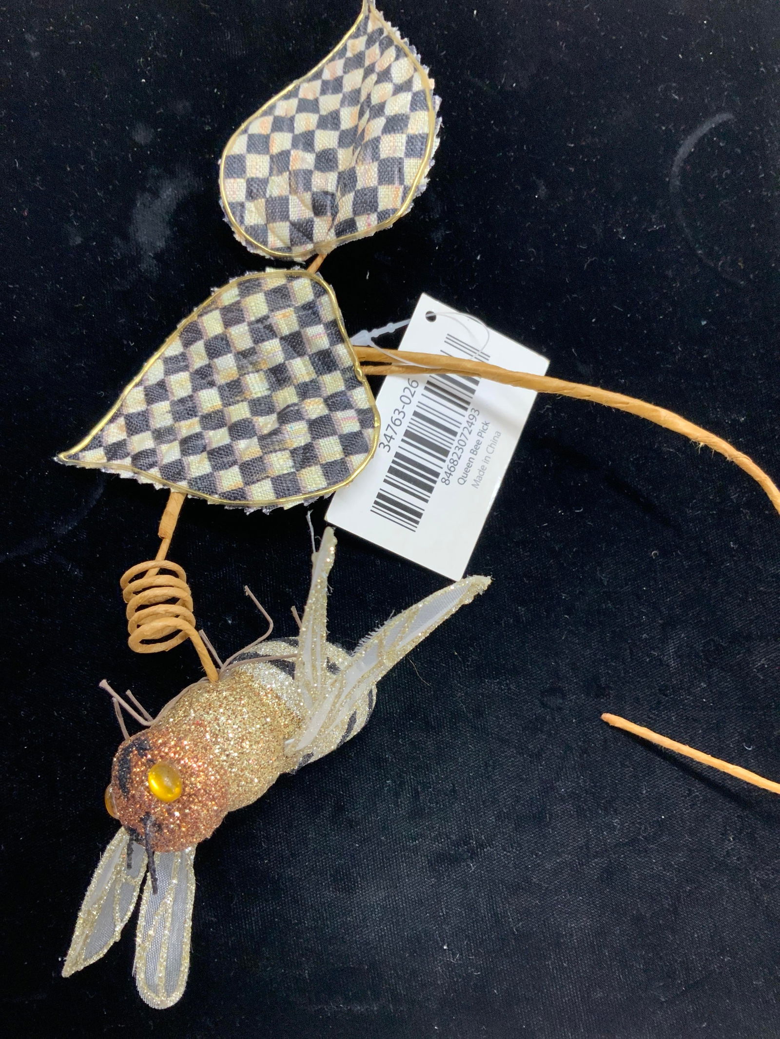 MacKensie Childs Queen Bee Accessory, NWT: Cute accessory you add to a plant, hand from ceiling or on wall, or use as an ornament., Styrofoam glitter bee with wings attached to a raffia covered wire with fabric leaves, new with tag, MacKensie