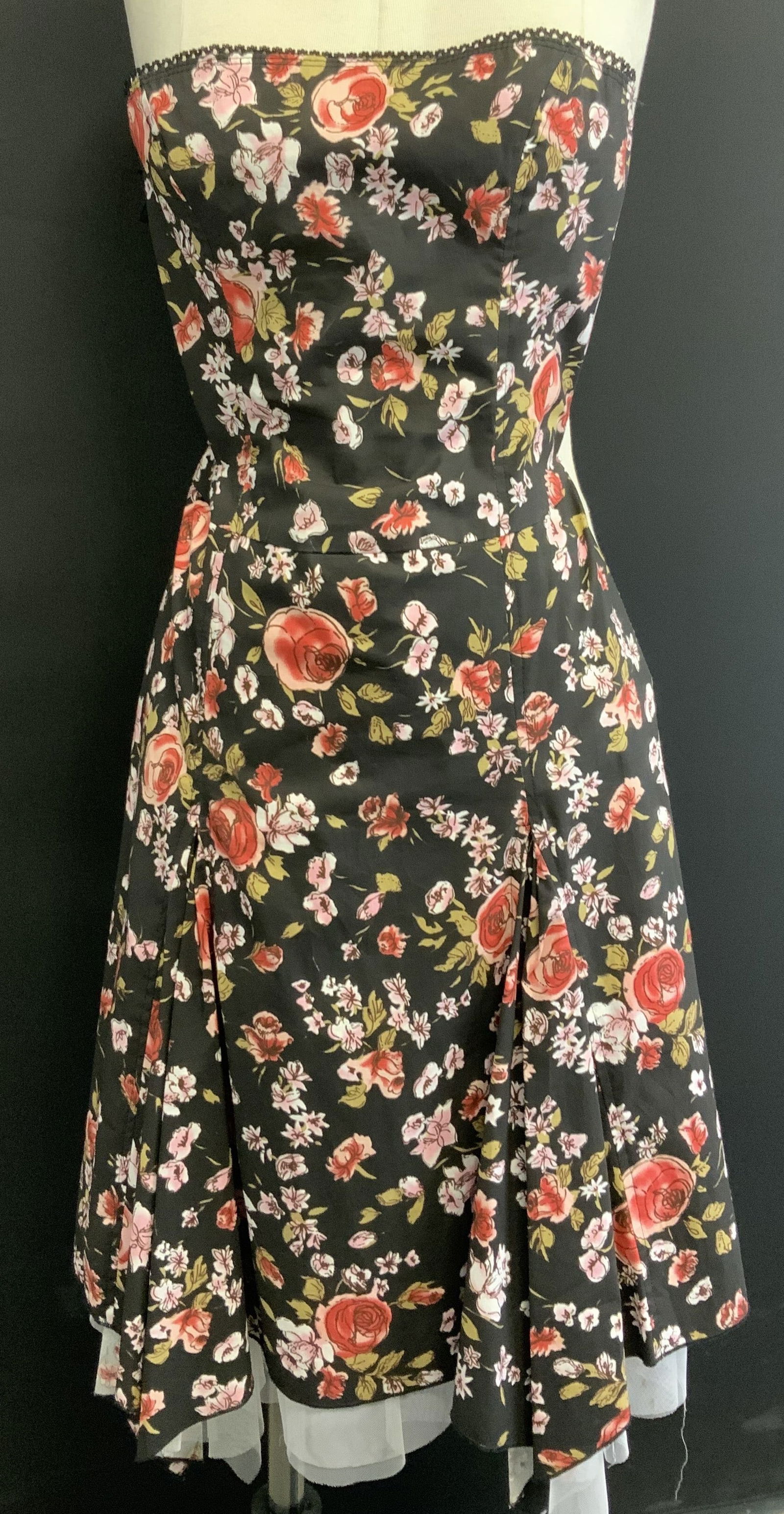 Zio Cotton Floral Summer Sleeveless Dress: Black sleeveless dress with pink and red florals, taupe leaves. Size Small.97% cotton, 3% spandex. Like new. Underside has a stretch lower body lining with lower tulle . Backside zipper. Asymmetrical