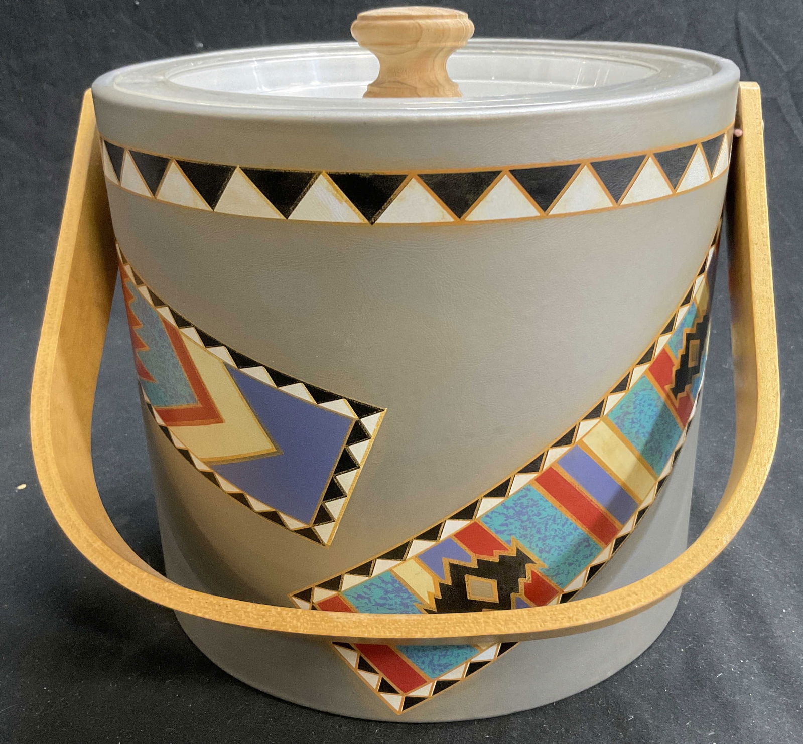 Vintage GEORGES BRIARD MCM Vinyl Ice Bucket: Vintage signed GEORGES BRIARD MCM Vinyl Ice Bucket with Southwest design. Wooden handle with acrylic and wooden lid. Measures approx. 7H x 24.5D in. Some surface wear consistent with age and use. Vint