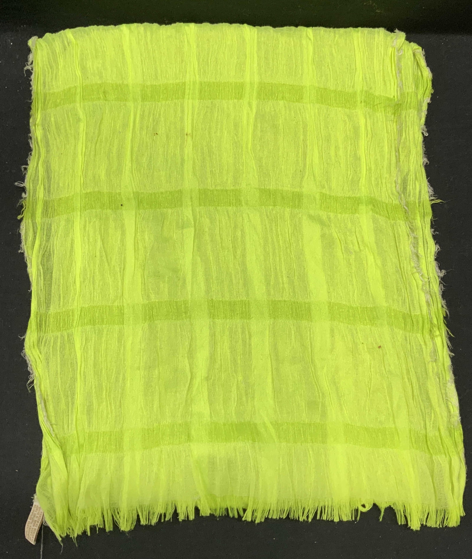 Collection 18 Neon Yellow Pleated Scarf: Collection 18 Neon yellow pleated raw edge scarf. Designer label on tag. Polyester blend. Measures approx. 78 inches long. Some wear to material, pulling and blemishes observed. Collection 18, collect
