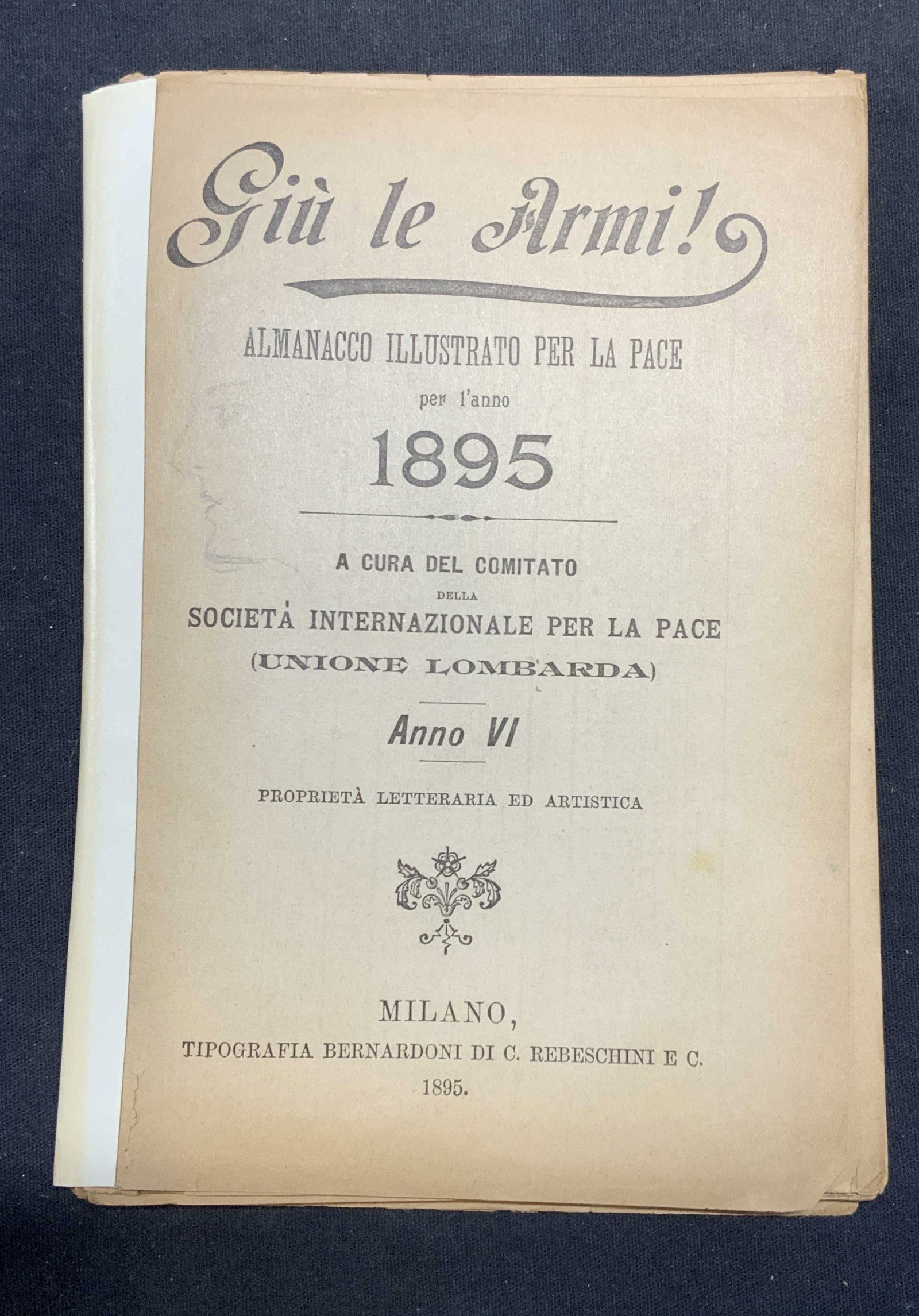 1895 Illustrated Almanac For Peace, Italy: Antique soft cover copy of Guns Down! Illustrated Almanac For Peace, 1895. By the committee of The International Society For Peace. Published by C. Rebeschini & Co. Written in Italian. Contains black 