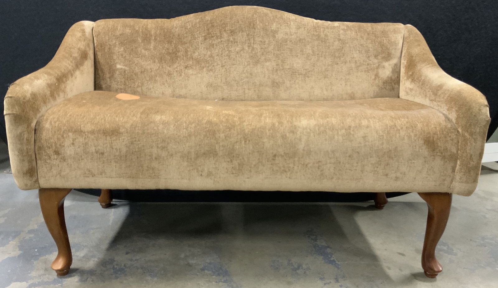 Vintage Queen Anne Loveseat Bench: Loveseat is vintage possibly antique. Piece has 4 carved wooden Queen Anne Legs. Loveseat has beige toned upholstery. Piece measures approx 44 inches long 28 inches tall 22 inches deep. Sofa, couch, l