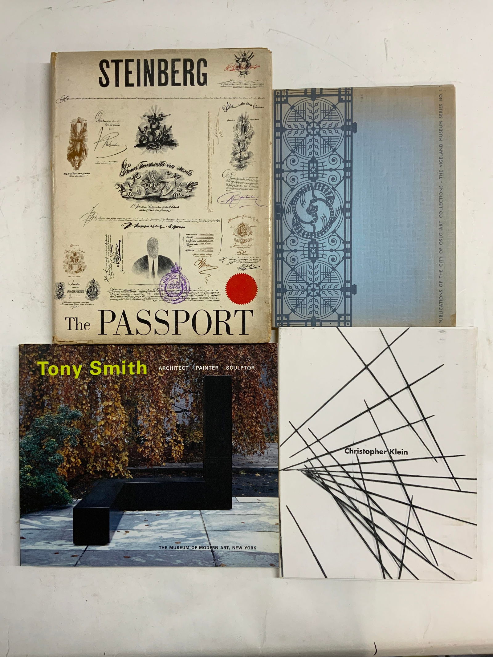 Lot 4 Vintage Art Books 1954-1998, Illustrated: Lot Includes CHRISTOPHER KLEIN, THE ART OF GUSTAV VIGELAND IN 48 PICTURES (Publ 1964). TONY SMITH (Publ 1998). THE PASSPORT BY SAUL STEINBERG First Edition (Publ 1954). Largest book measures approxima
