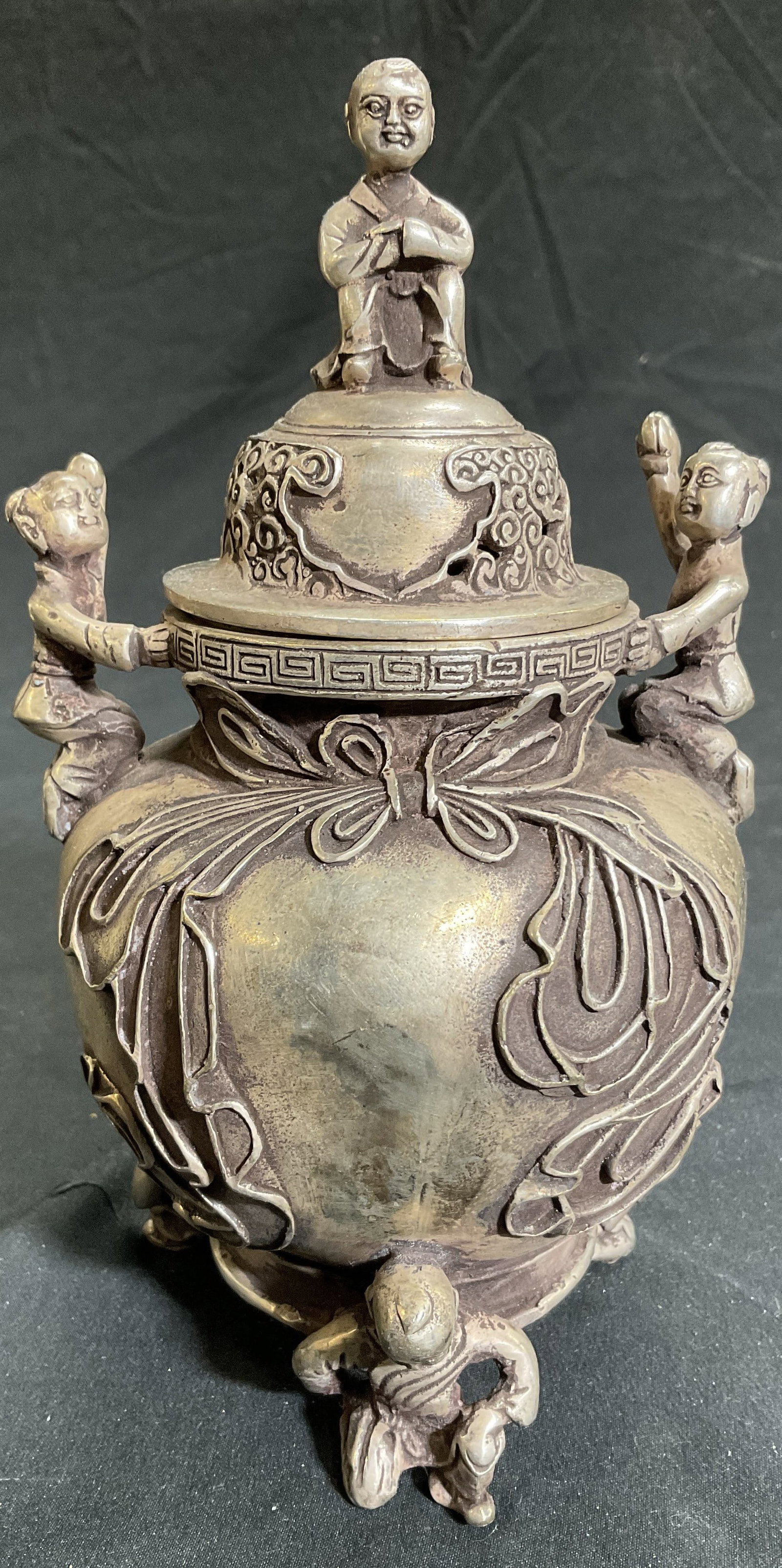 Signed Silvered Brass Lidded Asian Incense Burner: Incense burner is signed with Asian characters on underside. Piece has 2 figural handles, 3 figural feet & figural top to lid. Piece appears to be silvered brass 7.5 inches tall 4.25 inches wide. Ince