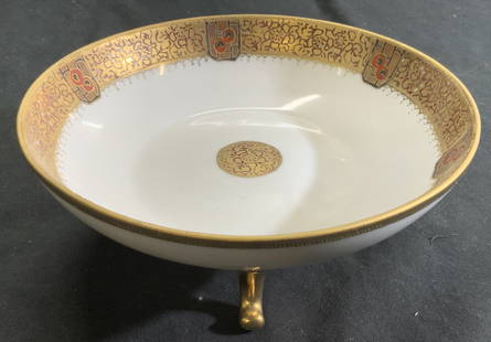 NIPPON Hand Painted Footed Porc Bowl Vessel: Underside is marked NIPPON HAND PAINTED. Piece is vintage. Bowl has hand painted and gilt detail to rim and medallion detail in center. Piece has 3 gilt curled feet. Vessel measures approx 6.75 inches