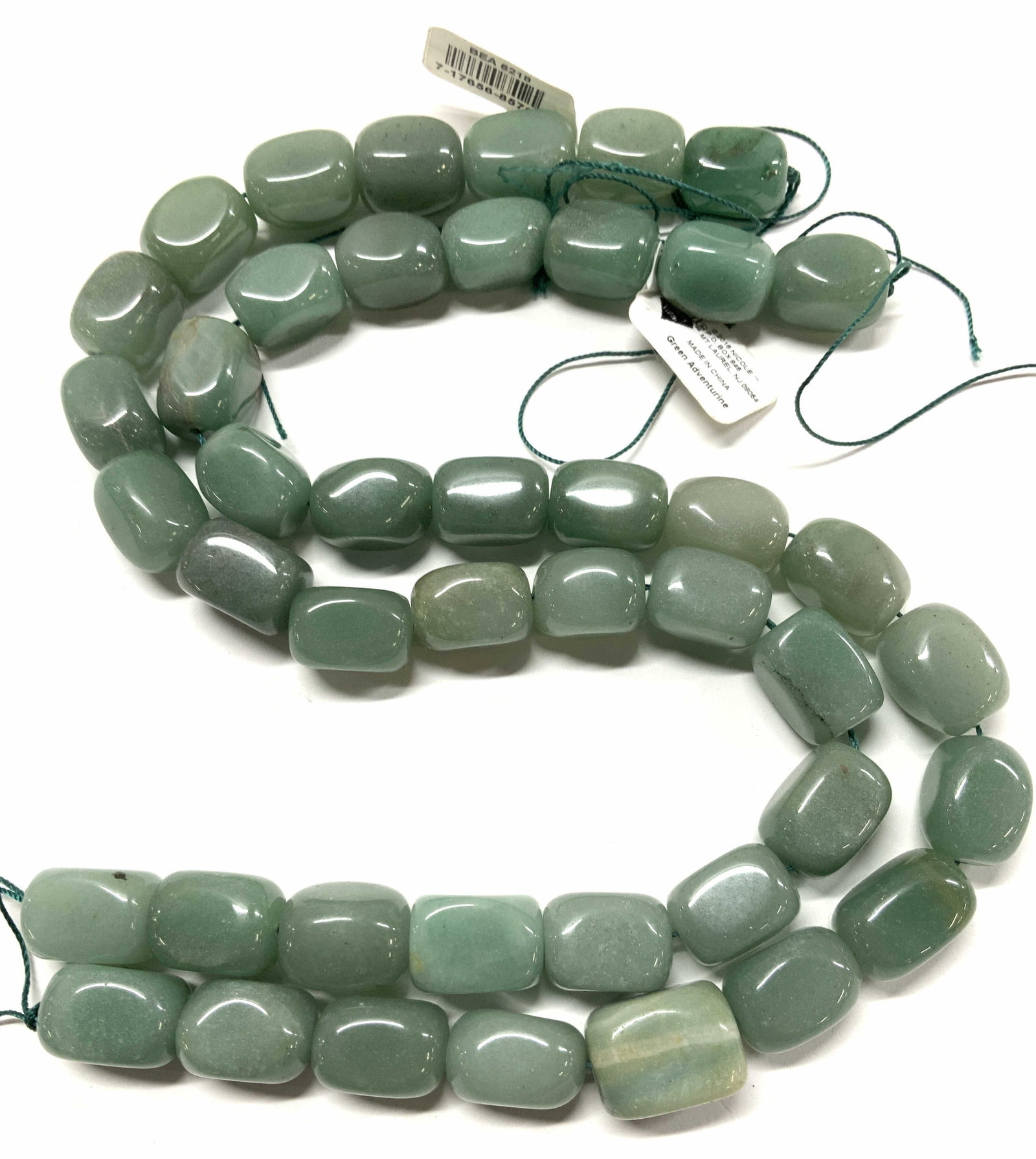 Green Adventurine Gemstone Beads, Jewelry: Polished adventurine beads strung on rope, unfinished necklaces or can be made into other jewelry, new with tag, labeled green adventurine .15.5 in. Long with extra length rope at ends. 44 gemstones, 