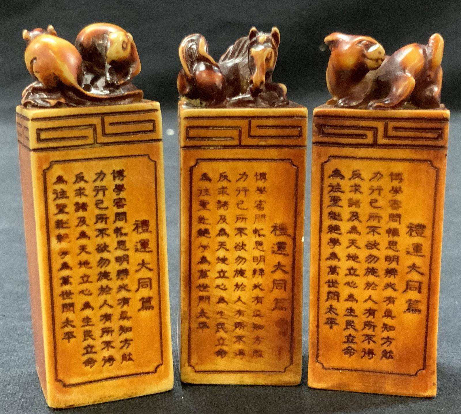 3 Vintage Carved & Dyed Zodiac Signature Blocks: Lot of 3 vintage Asian signature blocks with animals on tops, such as the rat, and horse and rabbit , each post has Chinese character etched in the sides with no carvings in other bottoms. Approximate