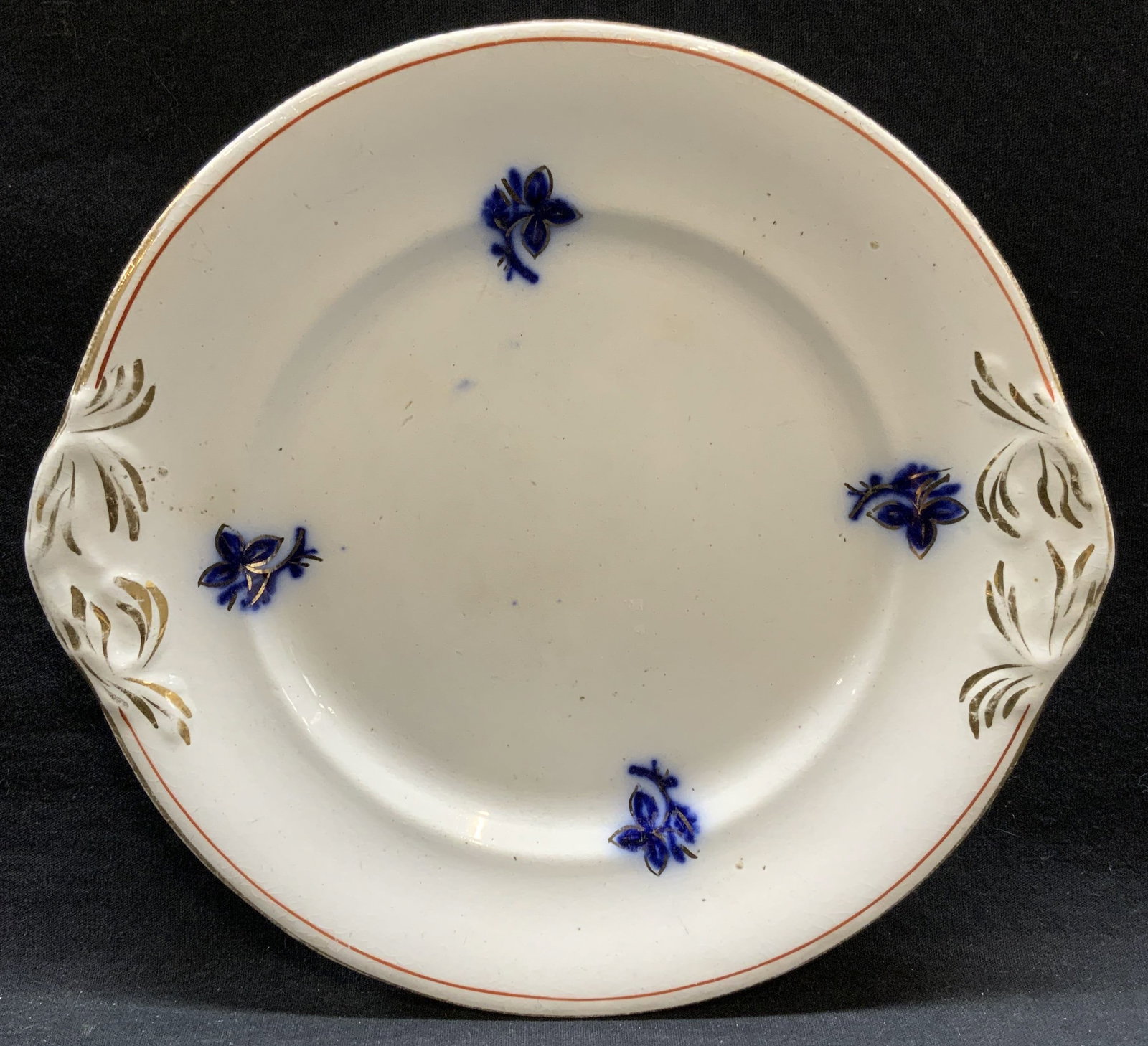 Antique Gilt Floral Porcelain Plate, Tableware: Antique gilt porcelain plate with blue floral pattern. Measures approx. 9.5 inches diameter. Surface wear including scratching, crazing and loss to gilt observed. Antiques, antique plate, collectible 