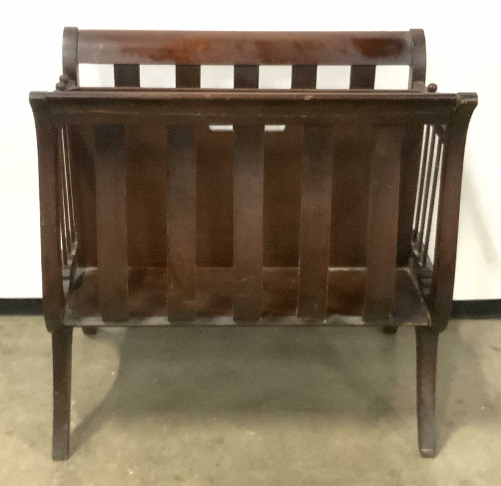 Vintage Wooden Harp Sided Magazine Rack: A vintage wooden harp sided magazine rack. Rich brown hue. Harp style design to sides. Some separation present, sone cracking, some losses present. Measures approx. 18H x 18W x 11D in. Vintage Magazin