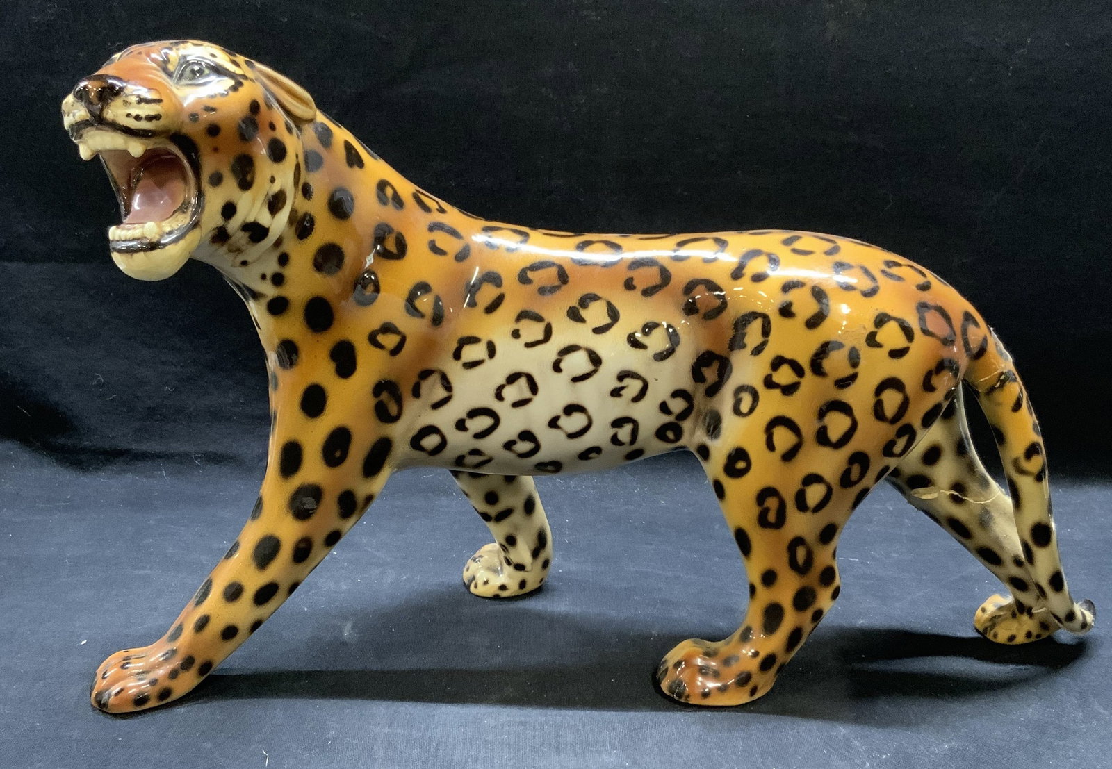 Vintage Ceramic Majolica Jaguar Figural: Vintage ceramic majolica jaguar figural. Trademarked to underside, illegible. Previously repaired to tail and leg. Measures approx. 15 x 6 x 9 inches. Majolica, majolica jaguar, ceramic jaguar, decora