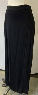 CHANEL Vtg Long Black Wool Maxi Skirt, France: Vintage Chanel skirt, feels like wool fabric with stretch. Stretch waist band with zipper and hook backside closure and gold tone CC button signed CHANEL on verso of button. Waist 32-34, length 38.5 i