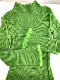 Tunic Metallic Knit Sweater with Rabbit Fur Cuffs: Size Small/ Medium Green knit sweater with green metallic threading . Un labeled , possibly hand knit , feels like cashmere. Has a long tunic shape with flares cuffs and added green rabbit fur to hem.