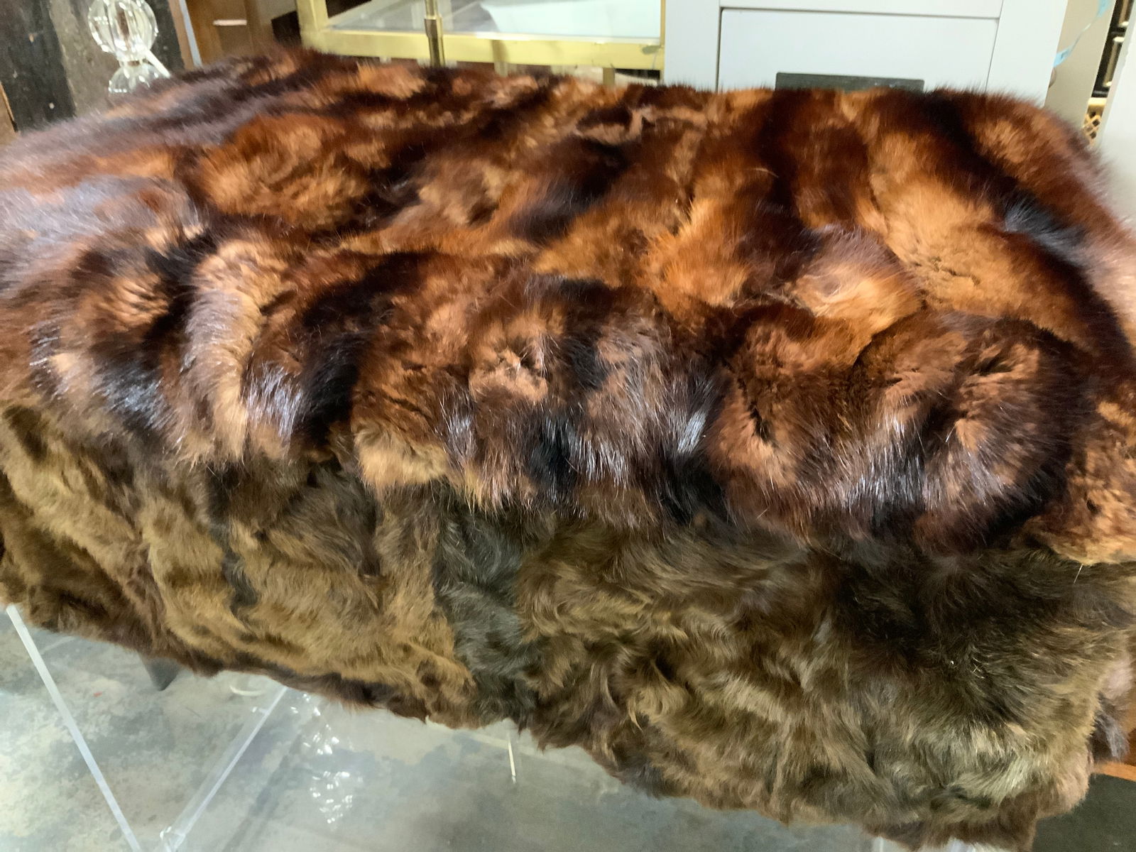 Vintage Fur Ottoman Cover: Combination of fur, dyed mink or fox of brown and black, on top, sides un known fur. Fully lined underneath. Areas where it needs repair. Measures 27 x 18 in. Ht 9 in. Combination of silk and rayon li