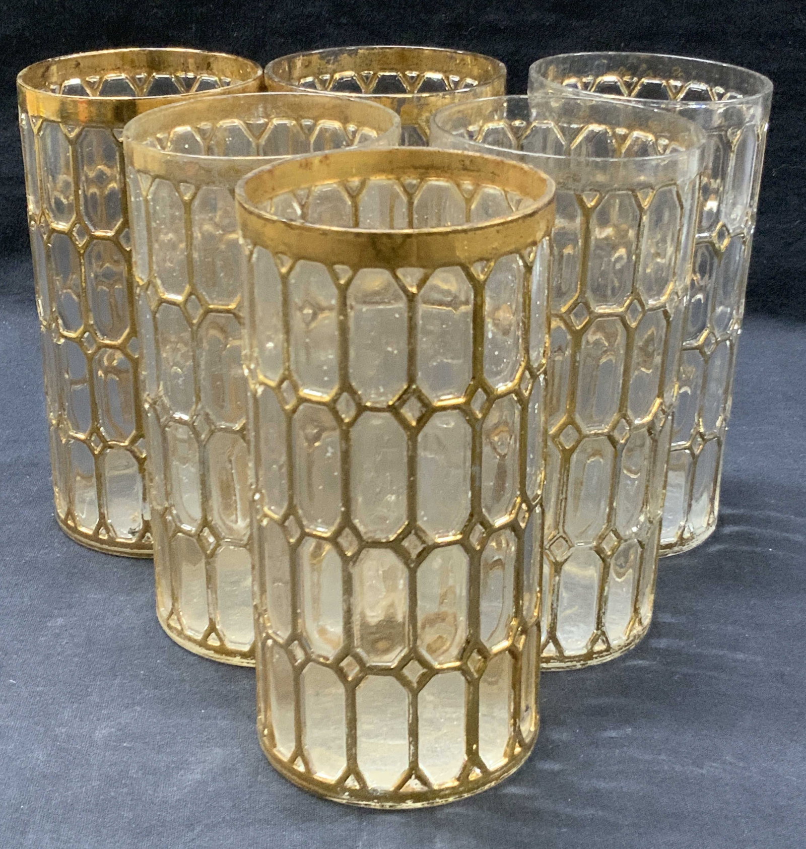 Set 6 Imperial Glass Gilt Highball Glasses: Set of 6 highball tumblers, marked on undecided with imperial glass logo, glasses are adorn with gilt on exterior with elongated octagonal patterns on exterior. Approx 5.75 inches tall and 3 inch diam
