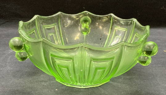 Art Deco Green Depression Glass Bowl: Vintage Art Deco green depression glass bowl. Scratching observed. Measures approx. 8.25 x 3.5 inches. Fluoresces under UV light, possibly uranium glass. Property of Manhattan estates and fashion indu