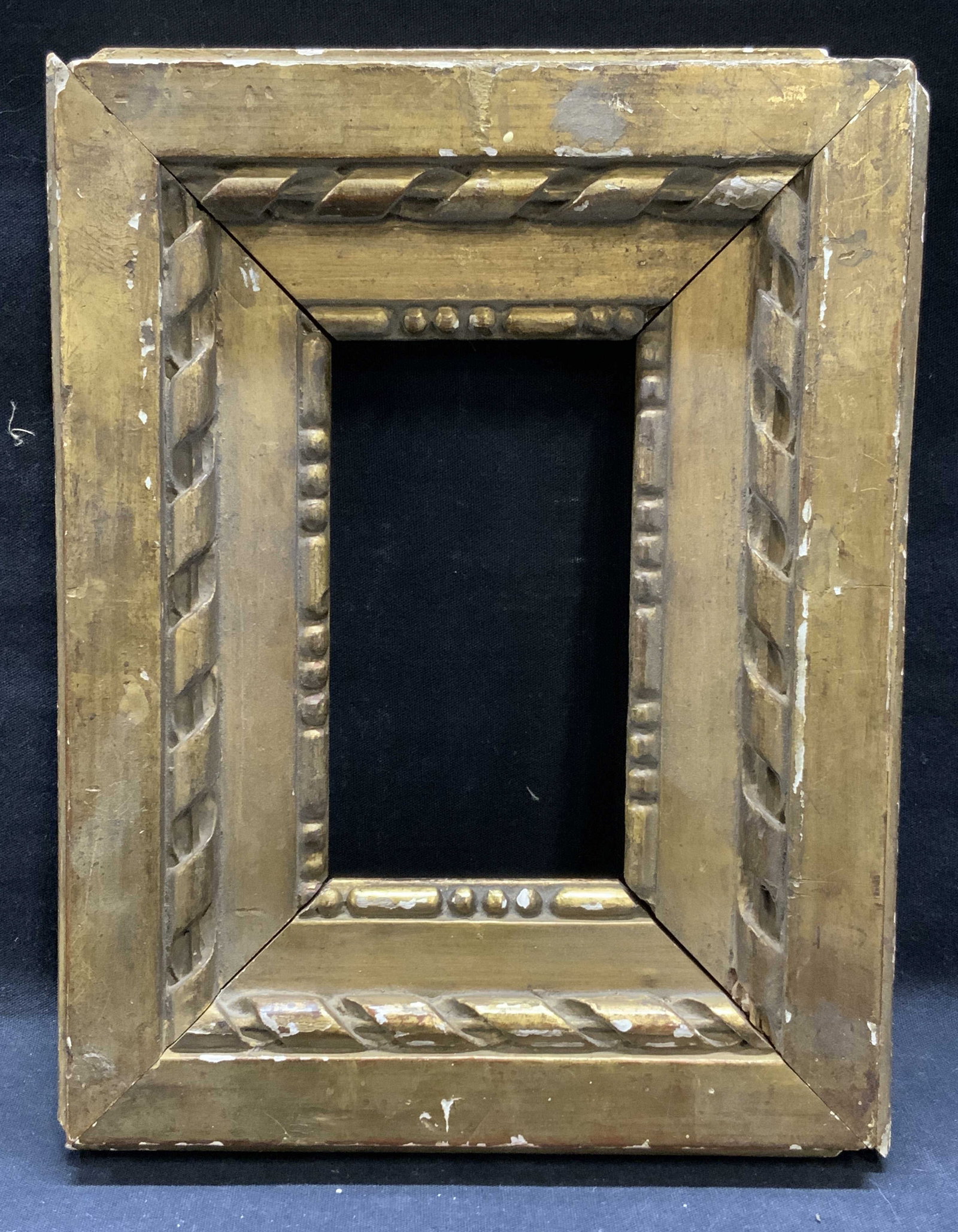 Vintage Gilt Wooden Frame: Vintage gilt wooden frame. Chipping and loss to gilt observed. Measures approx. 9.5 x 7.5 inches, window approx. 5 x 2.5 inches. Property of Manhattan estates and fashion industry executive. Frame, wo