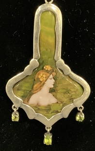 Sterling Silver Enameled Pendant Necklace: Vintage sterling silver pendant necklace with enameled Metal art nouveau style figural motif on pendant. Marked 925 on pendant. Drop length approx. 9 inches. Pendant approx. 3 x 1.75 inches. Some