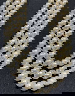 3 Strand White Pearl Necklace, 807 Carats: Vintage 3 strand white pearl necklace. Champagne and rose undertones. Drop length of shortest strand approx. 8.5 inches. Some surface wear consistent with exposure. Total weight 807.5 carats. Estate j