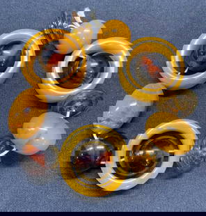 Amber & Bakelite Beaded Stretch Bracelet: Vintage amber and Bakelite beaded stretch bracelet measures approx. 2.75 inches wide, stretches wider. Dark colorless round amber beads fluoresce under UV light. Some surface wear including scratching