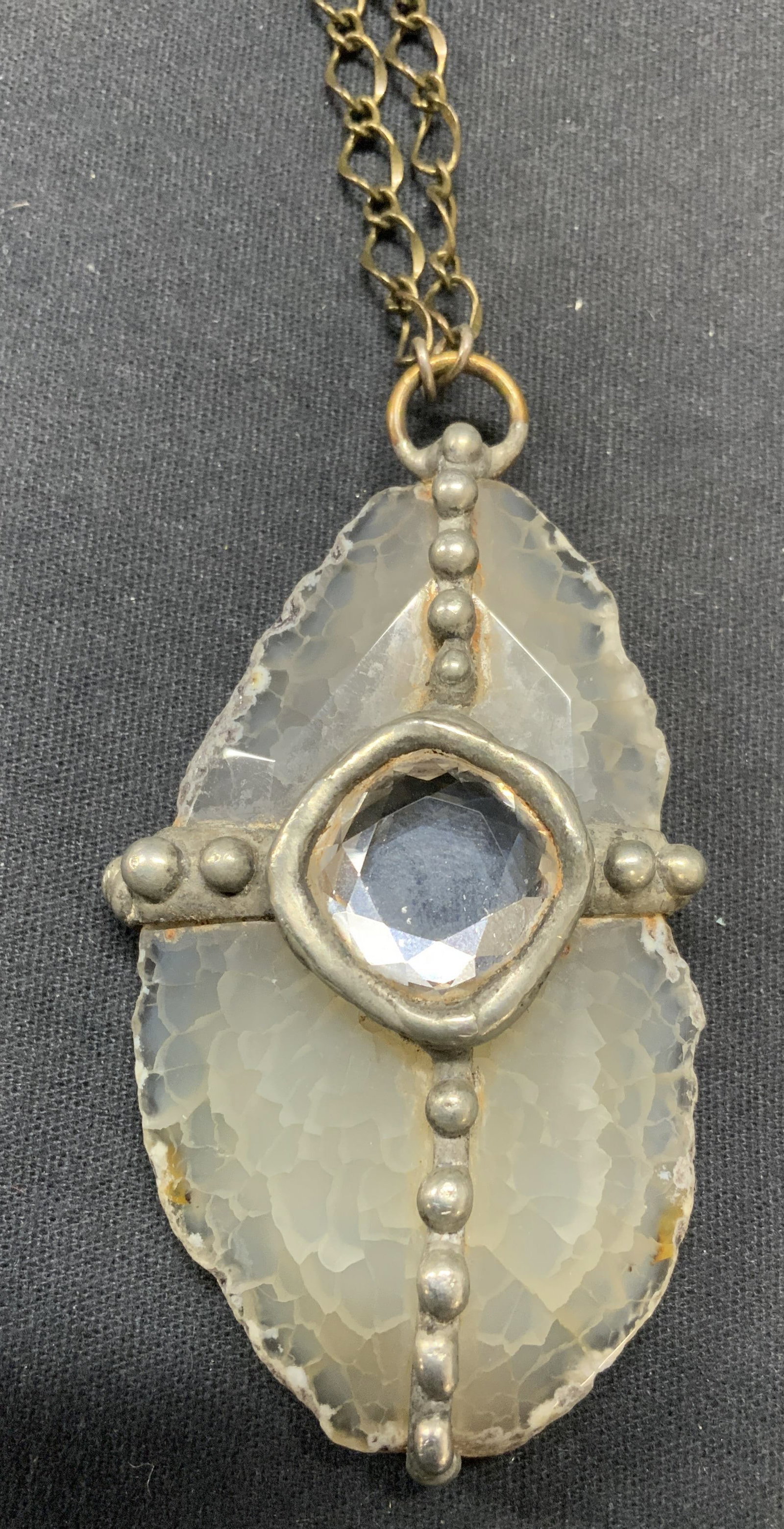 Signed WKA Rutilated Quartz Pendant Necklace: Signed WKA rutilated Quartz pendant necklace. Signed on necklace charm, dated 2018. Clasp marked 925. Drop length approx. 16 inches. Quartz measures approx. 3 x 1.5 inches. Some surface wear including
