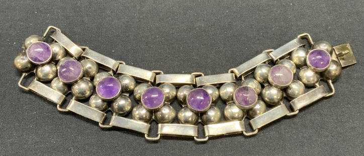 Sterling Silver & Amethyst Bracelet, Mexico: Sterling silver and amethyst bracelet. Marked Silver, Mexico to underside. Measures approx. 6.75 inches long. Some surface wear including scratching observed. Total weight 2.7 ozt. Includes jewelry bo