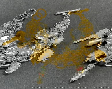 JOHN WIND Gold Tn Crystal Charm Bracelet: Vintage John Wind gold tone multi chain charm bracelet with colorless crystal, faux pearl, and gold tone charms. Signed on charm. Total length approx. 7 inches long. Faux pearl strand needs repair. So
